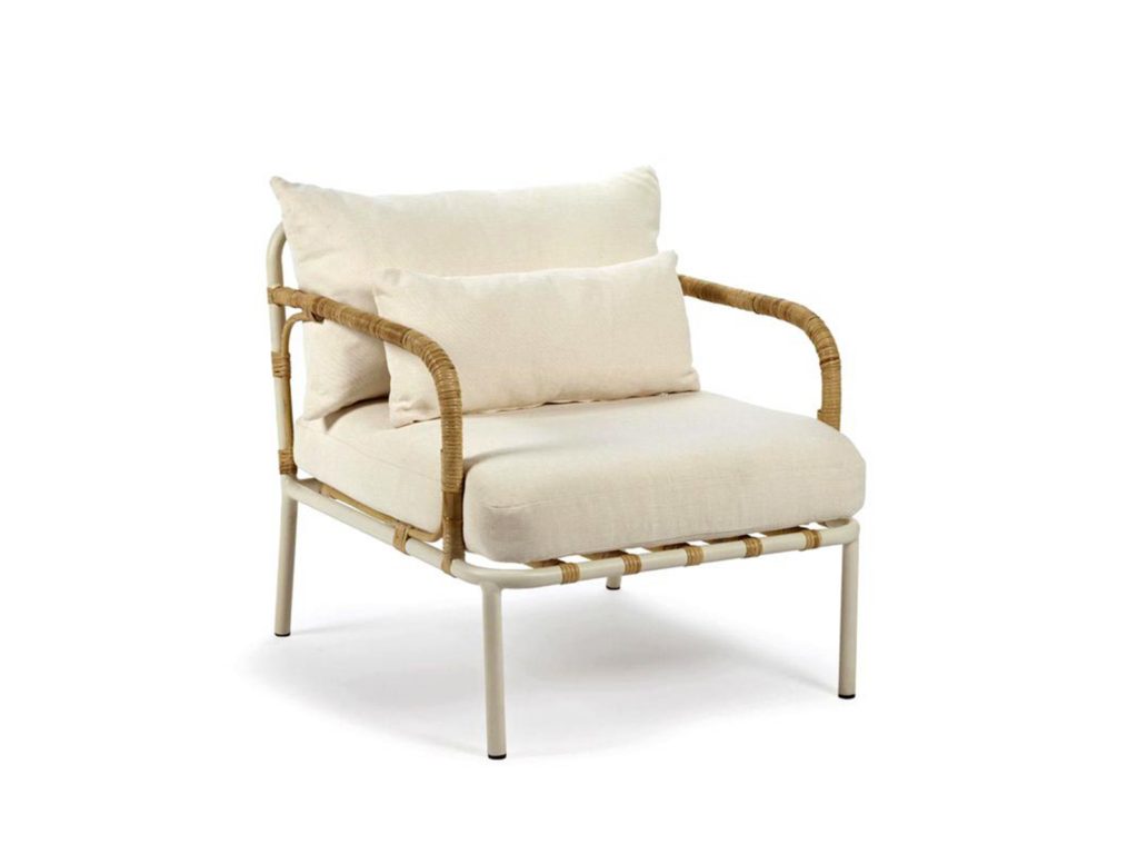 An aluminium and rattan chair with white cushions 