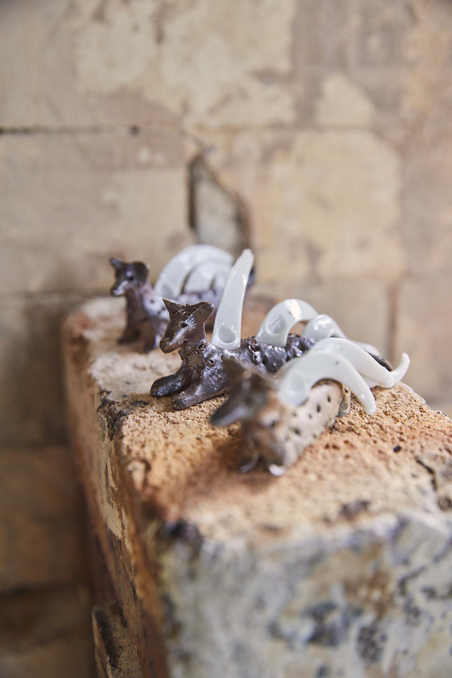 A close up of three ceramic dogs by artist Elena Renker