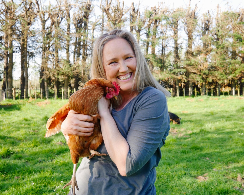 Katrina McClelland holding a chook