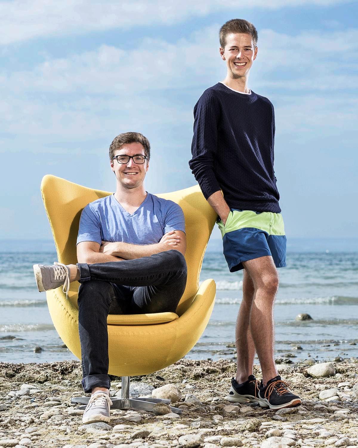David Nelles and Christian Serrer on the shore of a beach