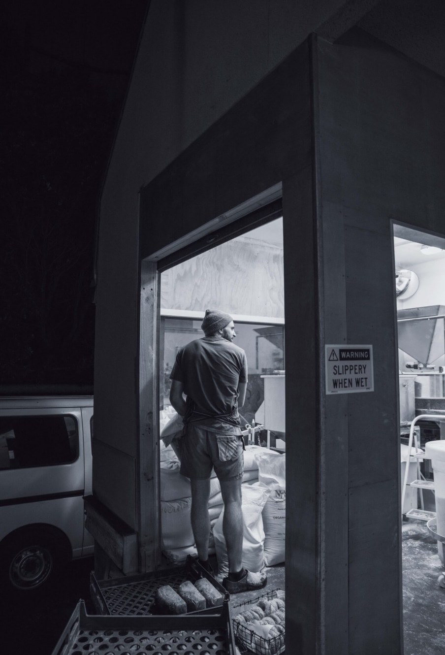 Black and white photo of Sam Forbes in Shelly Bay Baker