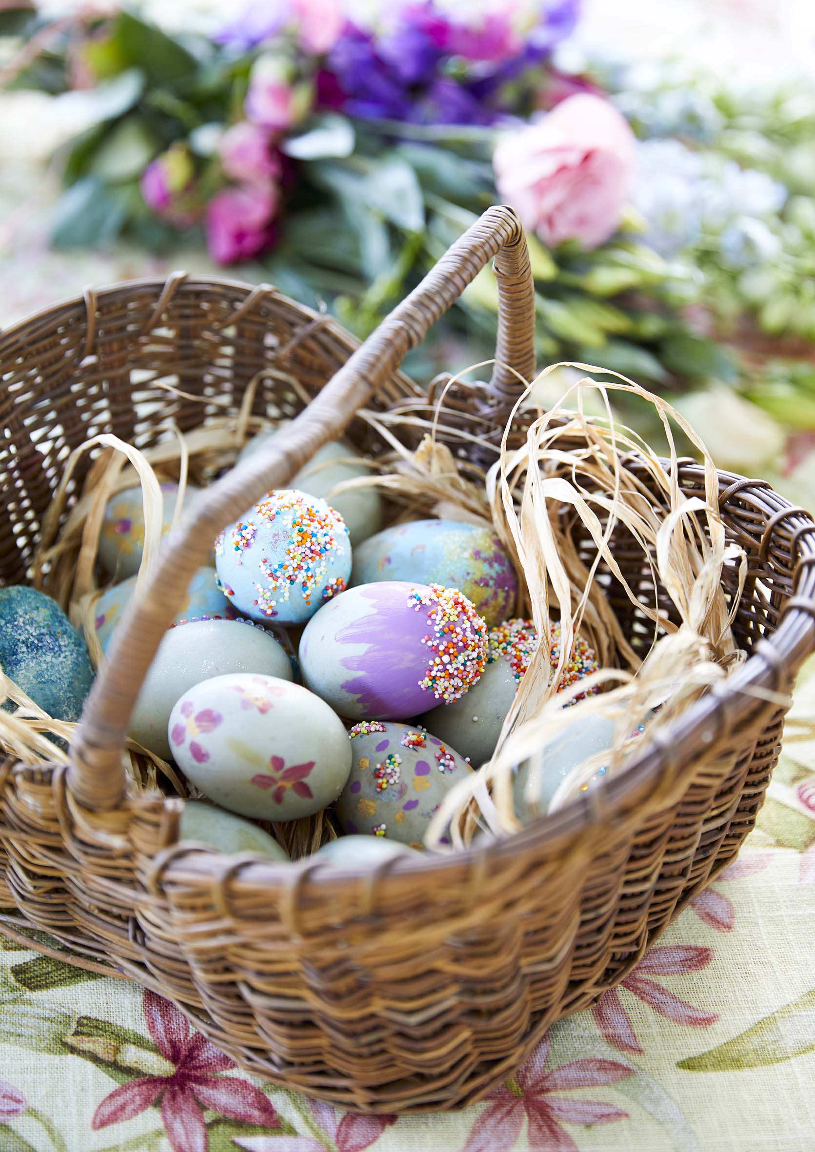 Colourfully decorated easter eggs in a basket