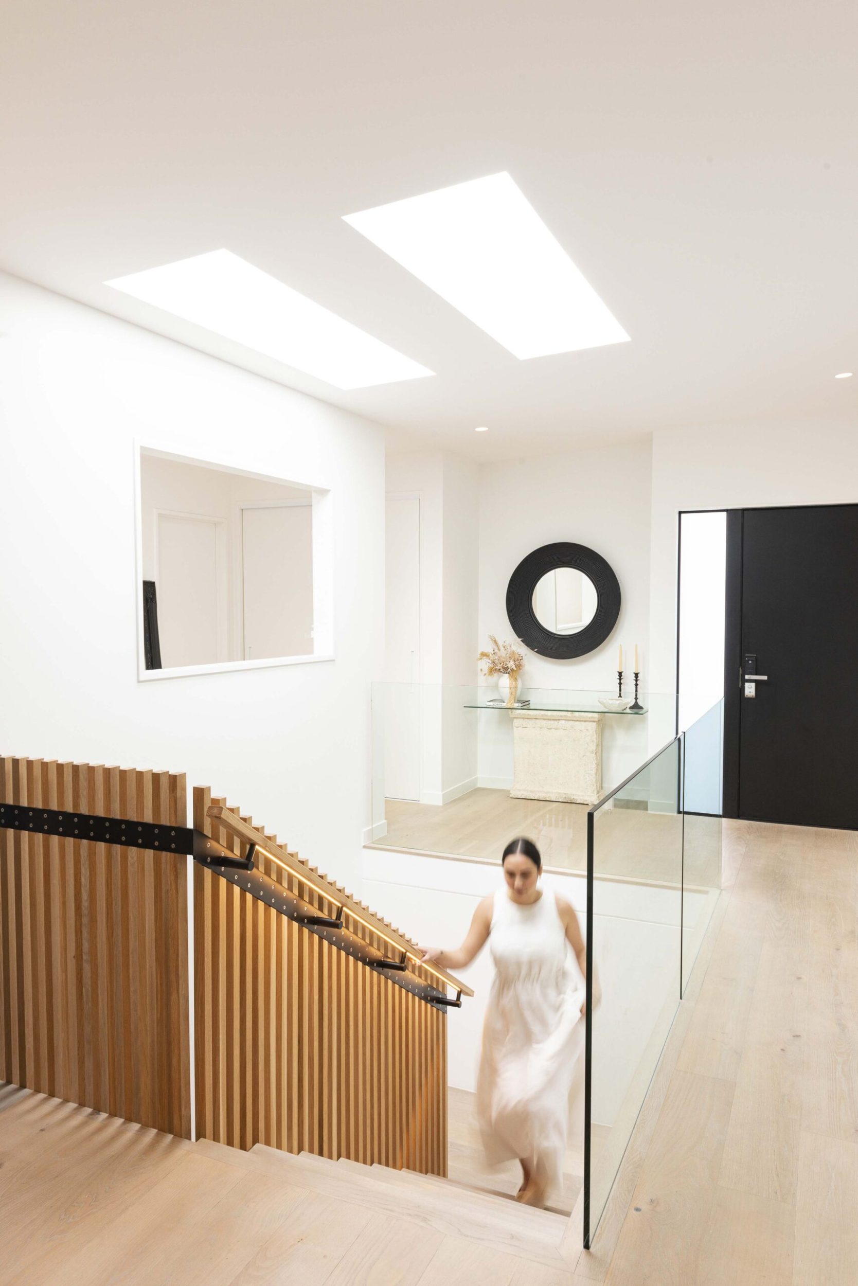 Fatima Savea walking up a timber staircase in her home