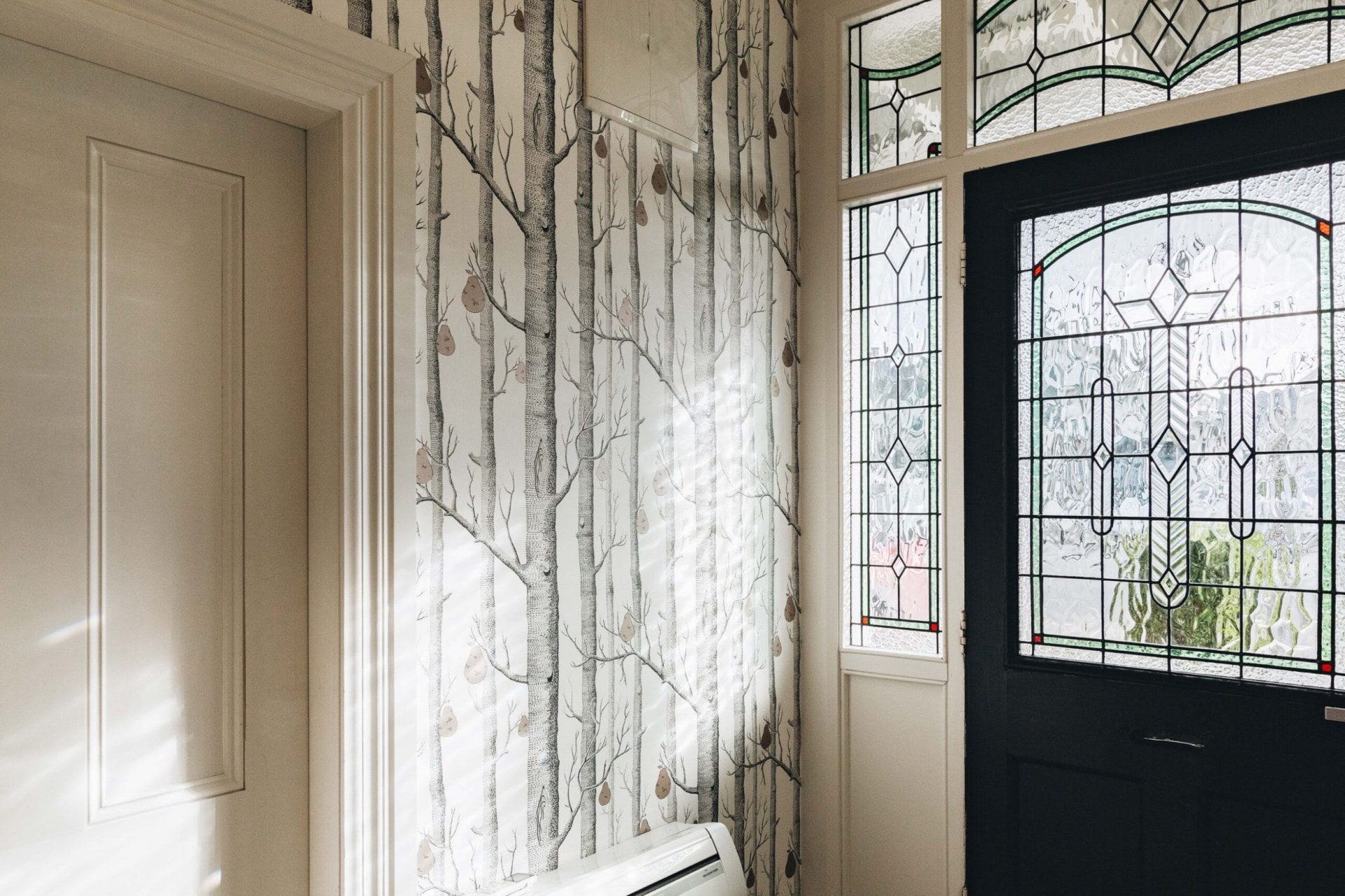 Cole & Son wallpaper in the entryway of Karen and Pete Delehanty's Wellington home