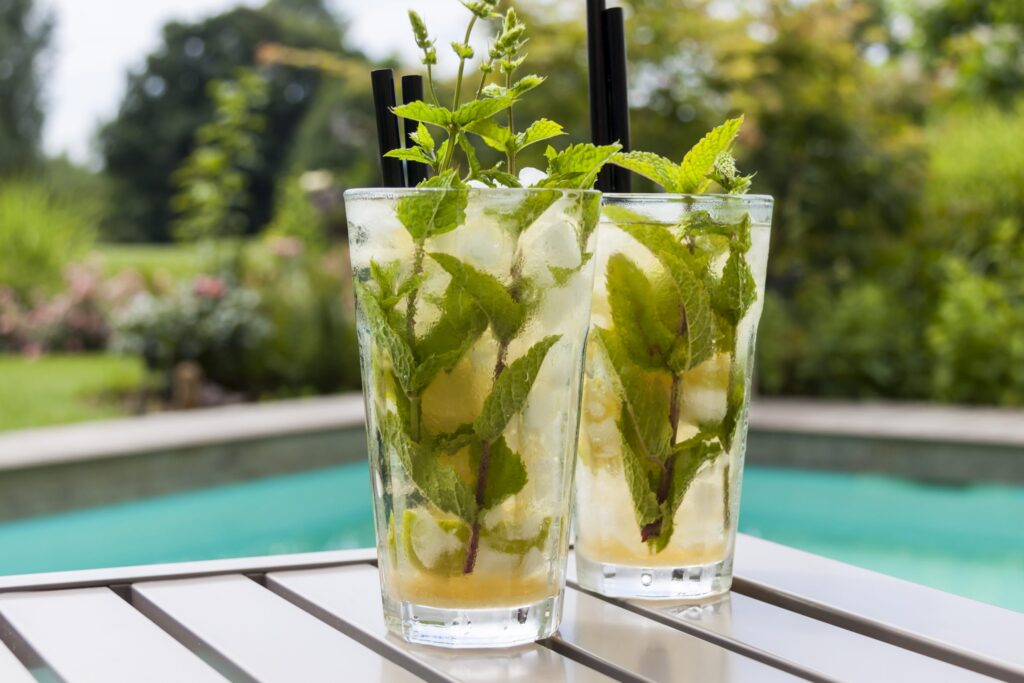 Two mojito cocktails on a table