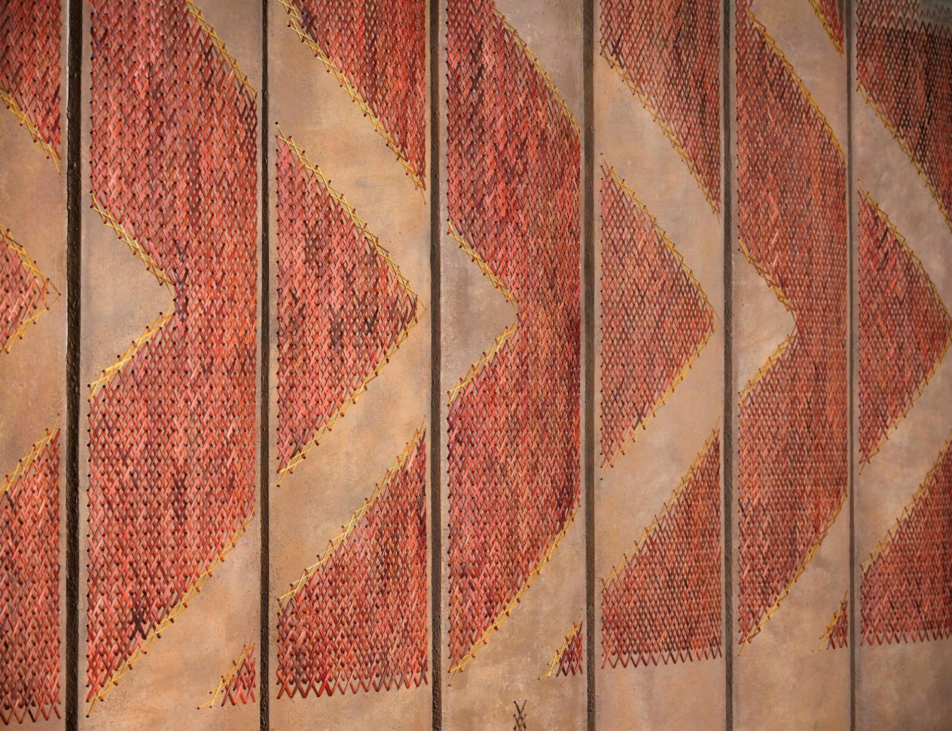 Woven panels that line the walkway in the Cordis Auckland