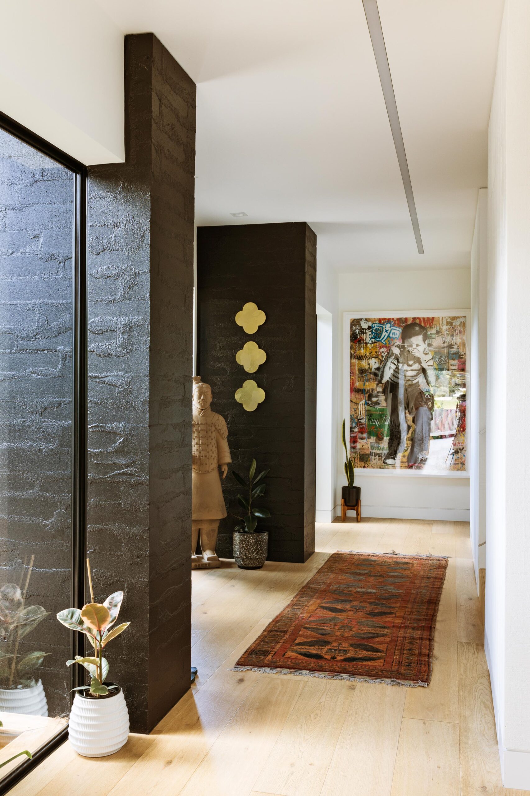 A sunny hallway lined with artwork.