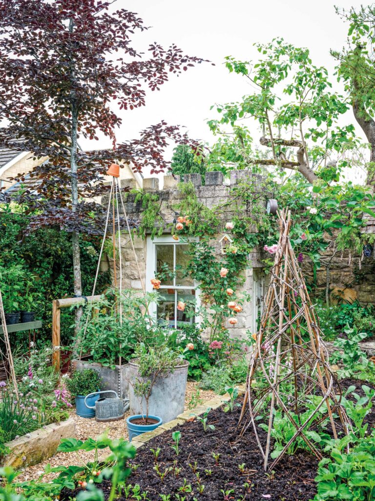 This pretty English garden is full of story book charm   Woman+