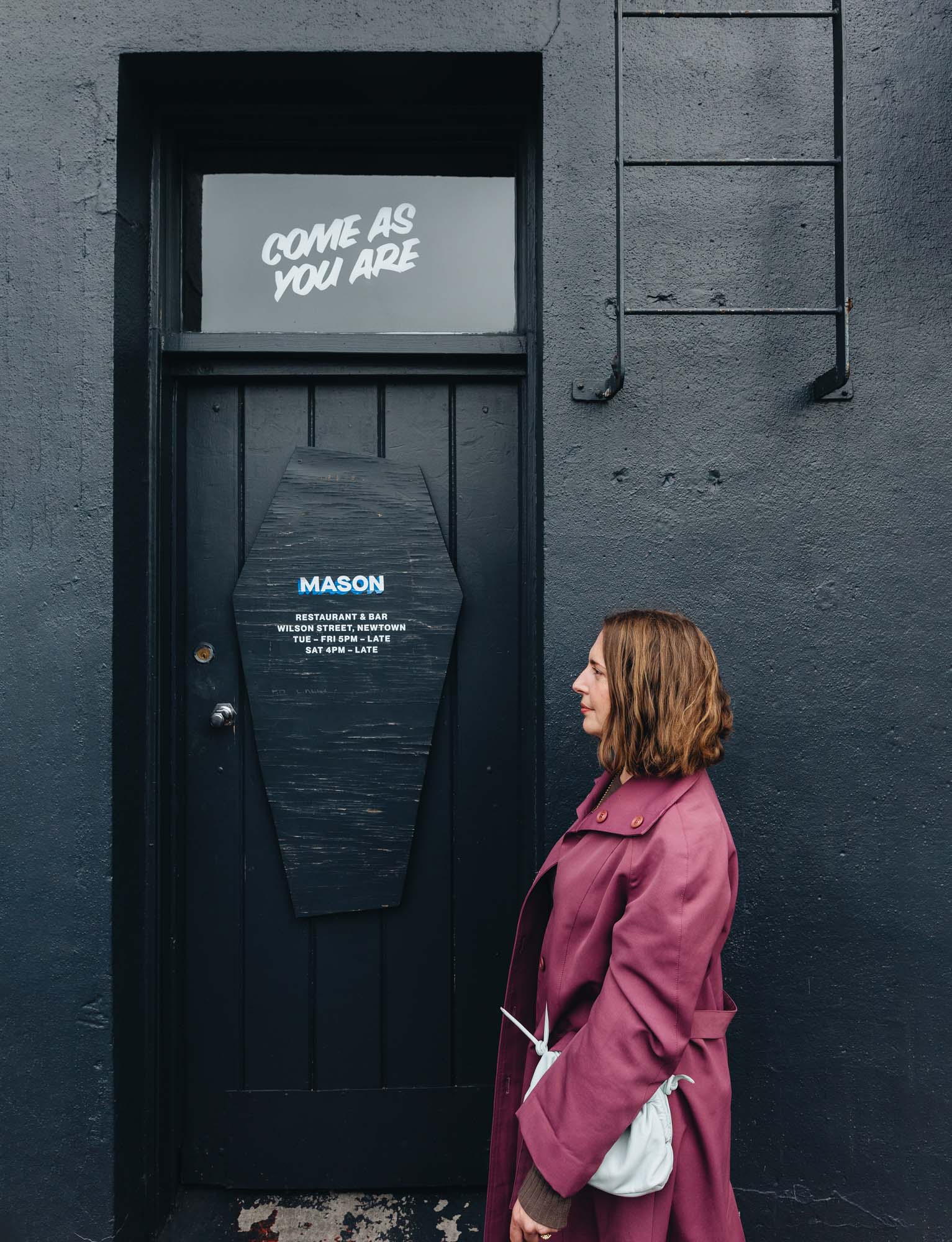 Jess Harkins in front of the Mason store door