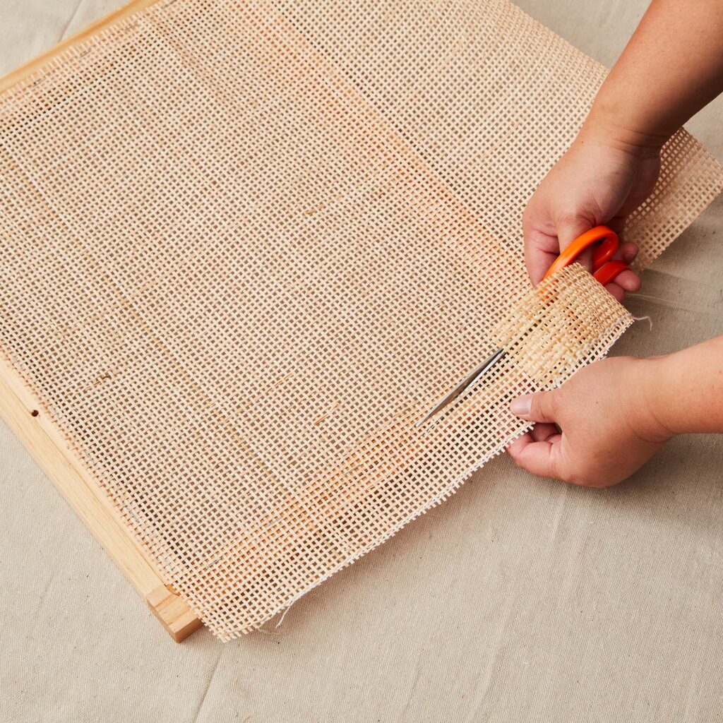 Trimming the rattan to fit the door