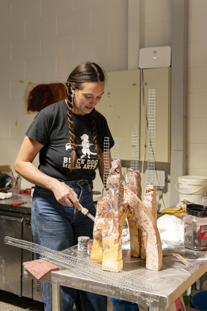 Kate Rutecki in the studio working on her Ghastly Studios candleabra