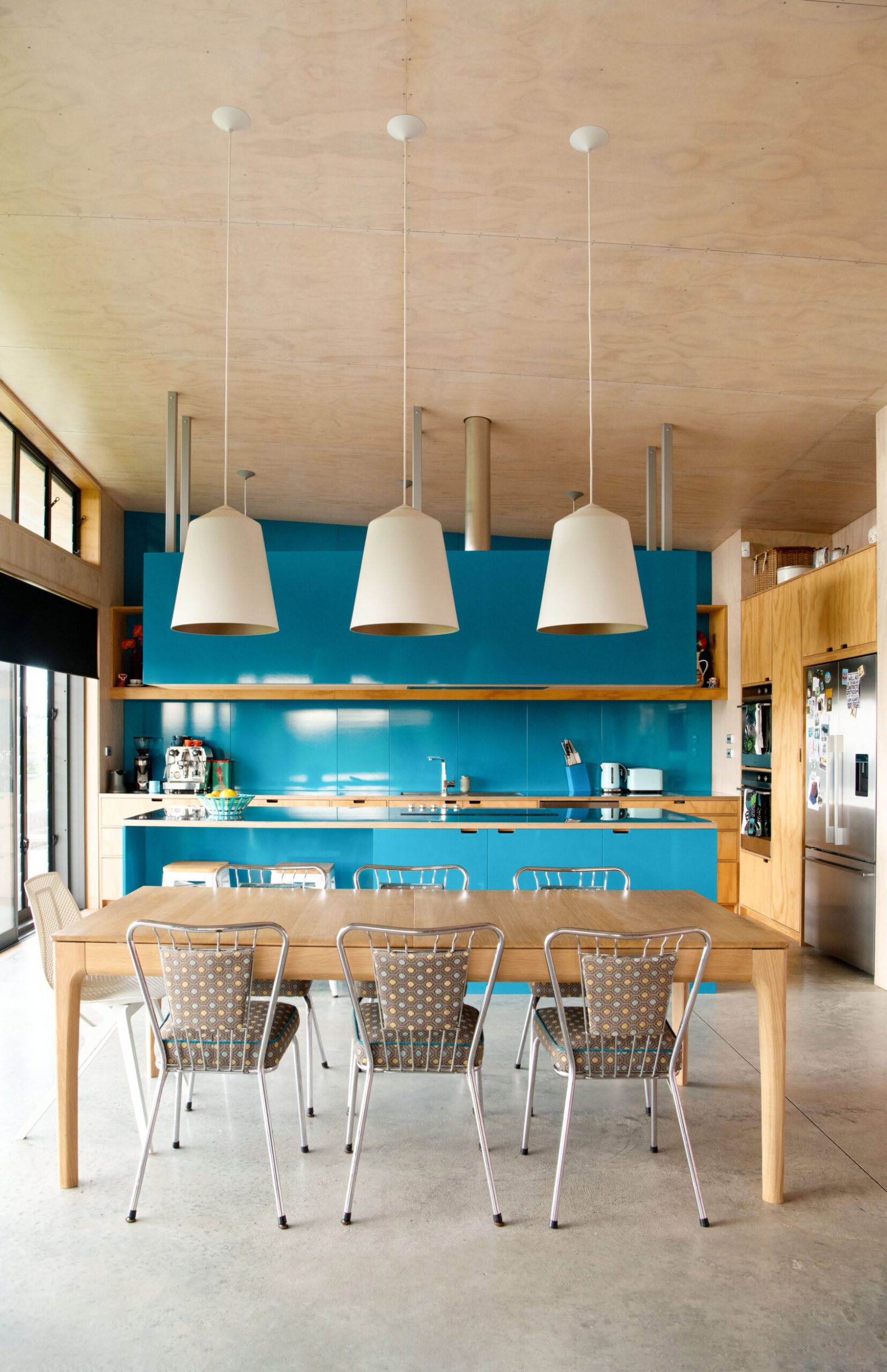 blue kitchen cupboards and dining room