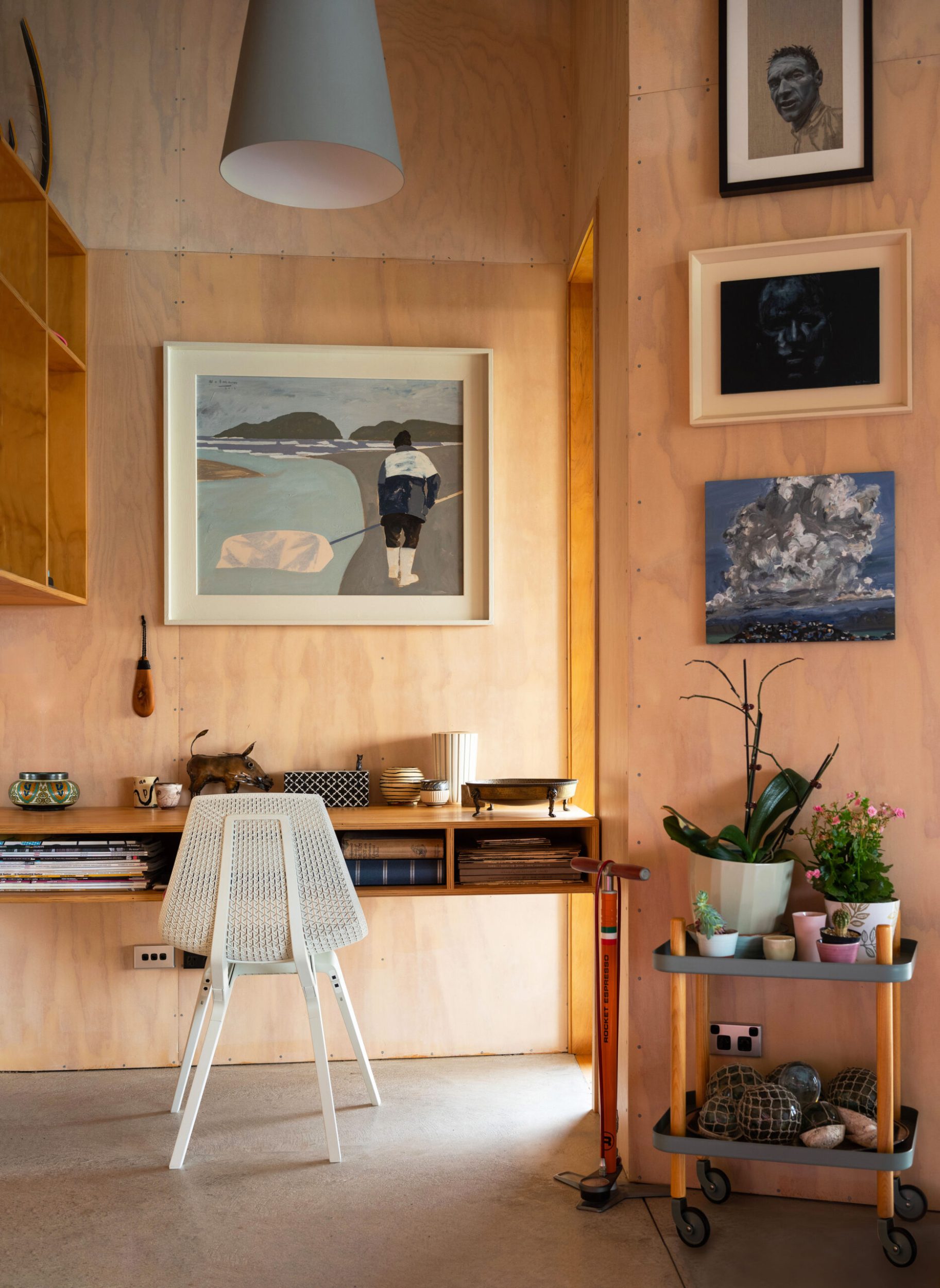 Art that depicts a whitebaiter above a plywood desk