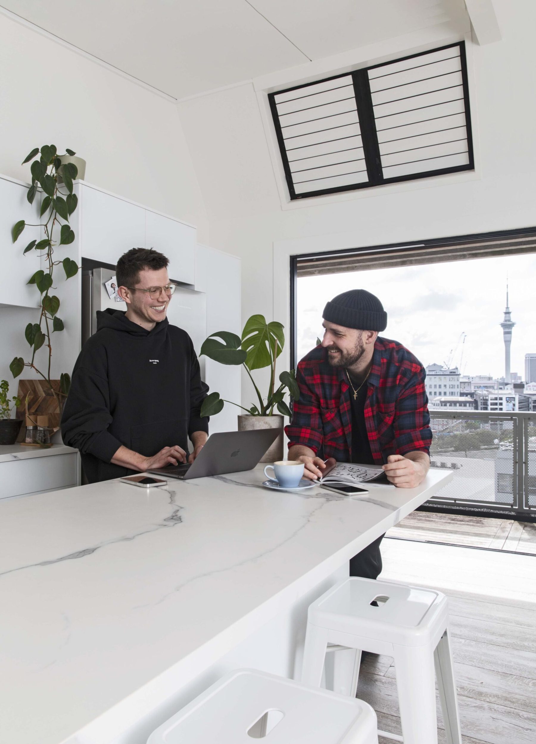 Guy Coombes and partner Chris in their Auckland city apartment