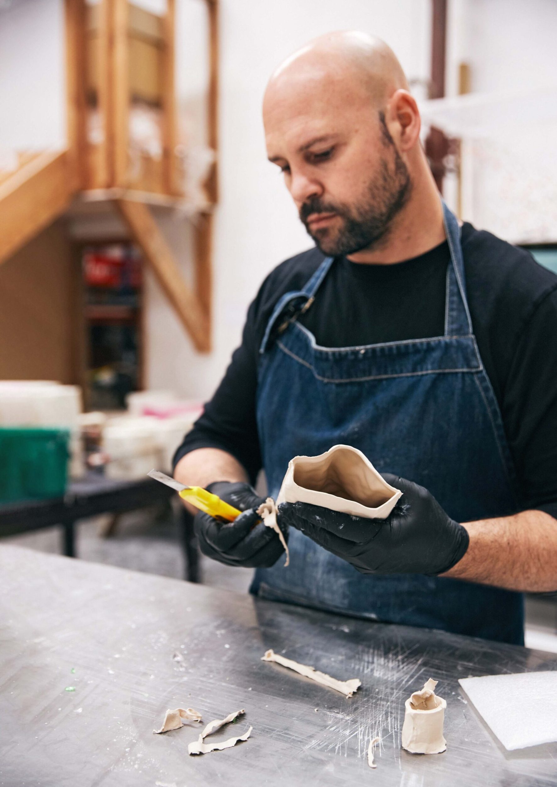 Simon Lewis Wards working in his studio in West Auckland