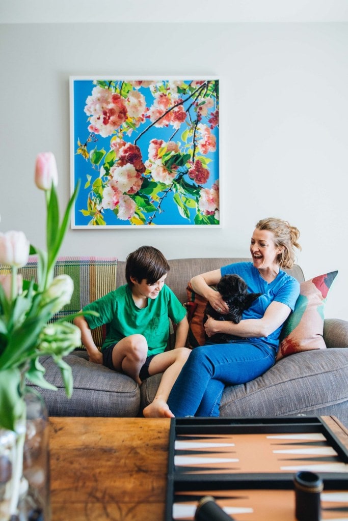 Nicola Cranfield and her son Hugh sitting on their grey living room couch