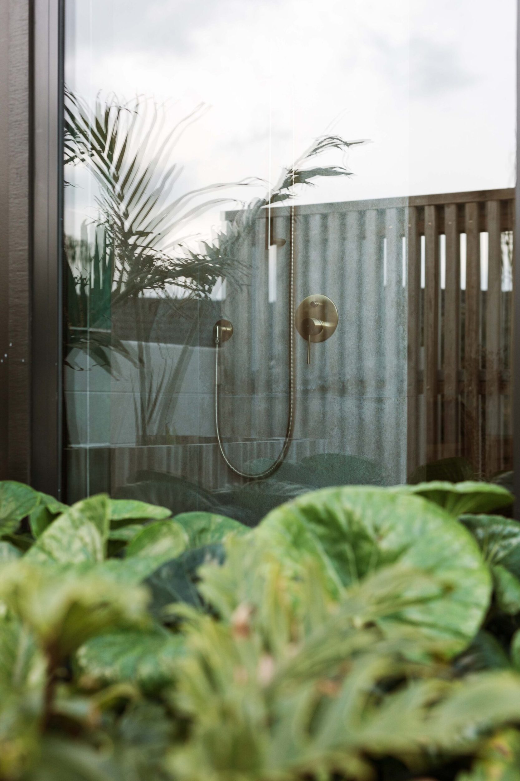 A shower seen from the outside through a large window