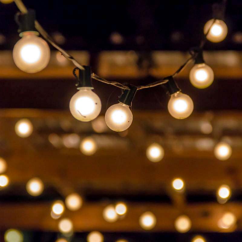 festoon lighting hanging from a pergola