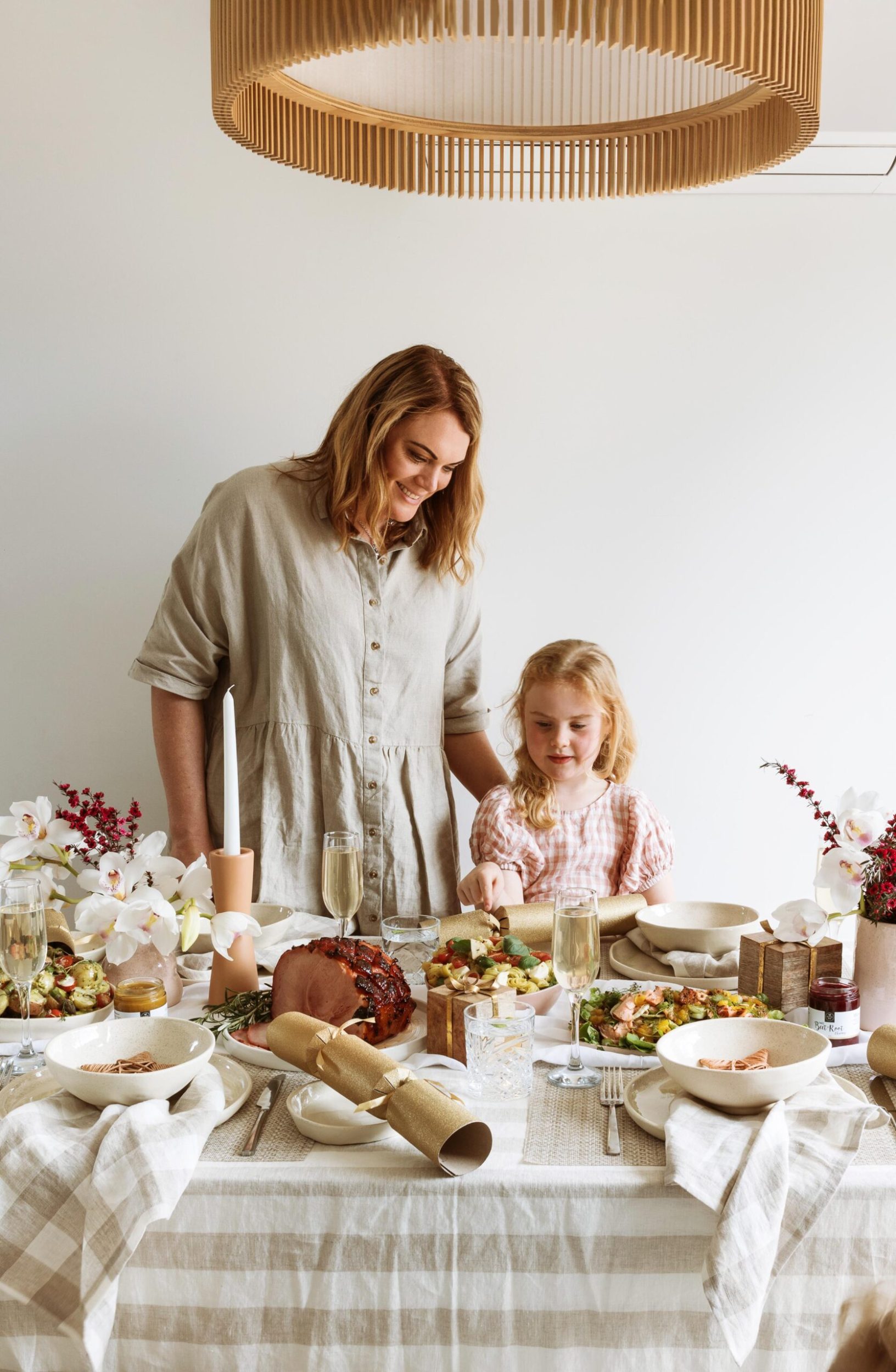 Cherie and daughter Pepper look over the Christmas spread on their dining table