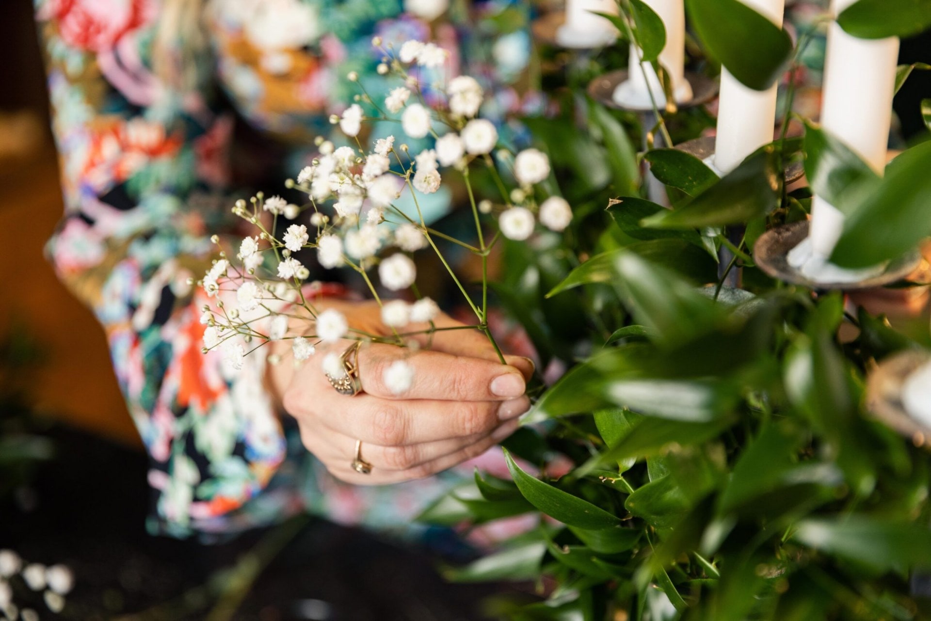 sliding the gypsophila into the candelabra