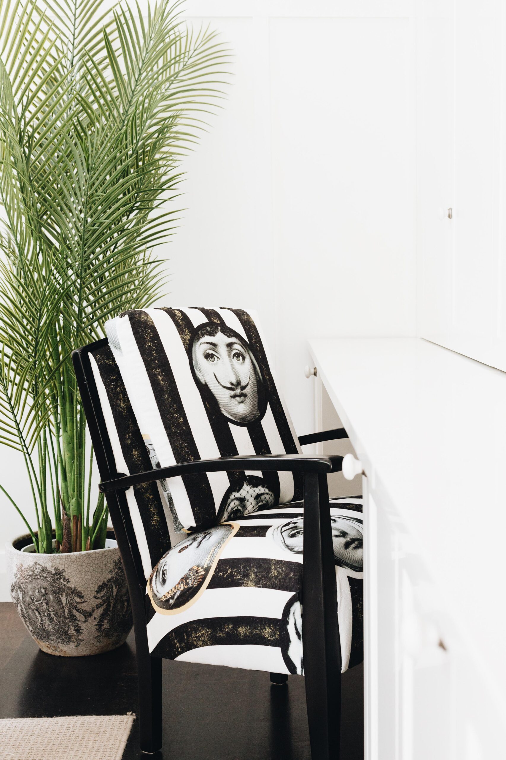 Lisa's mother's chair recovered in a black and white stripy fabric