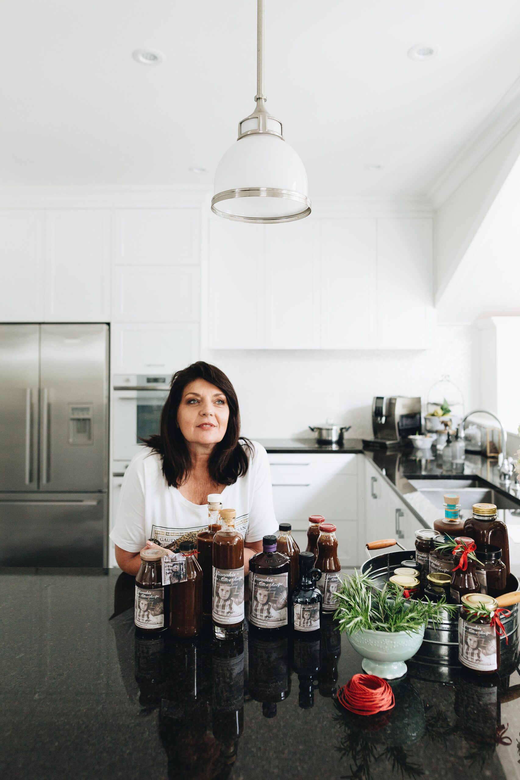 Lisa Antonopoulos leaning against her kitchen bench