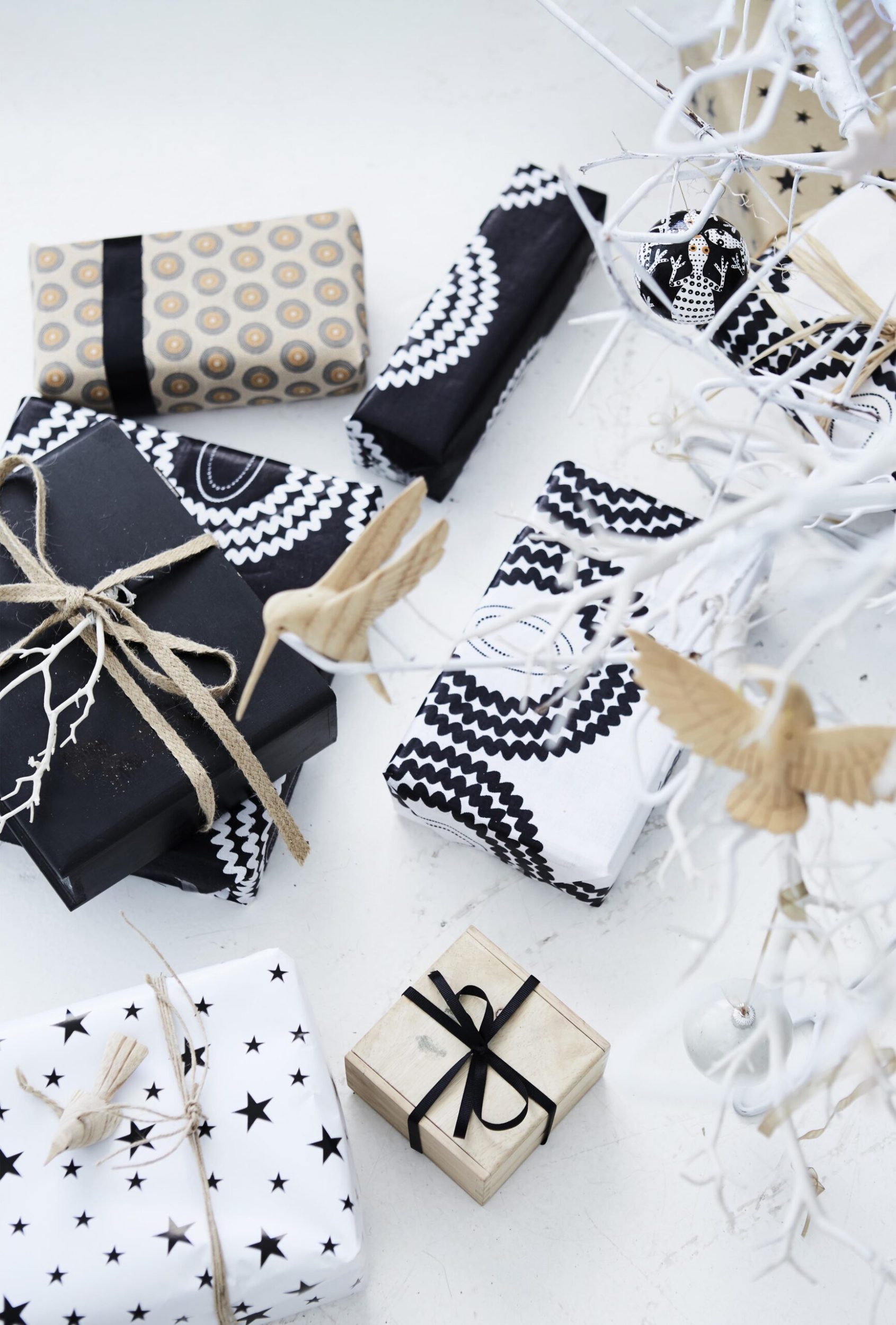 Christmas presents wrapped in black and white wrapping paper