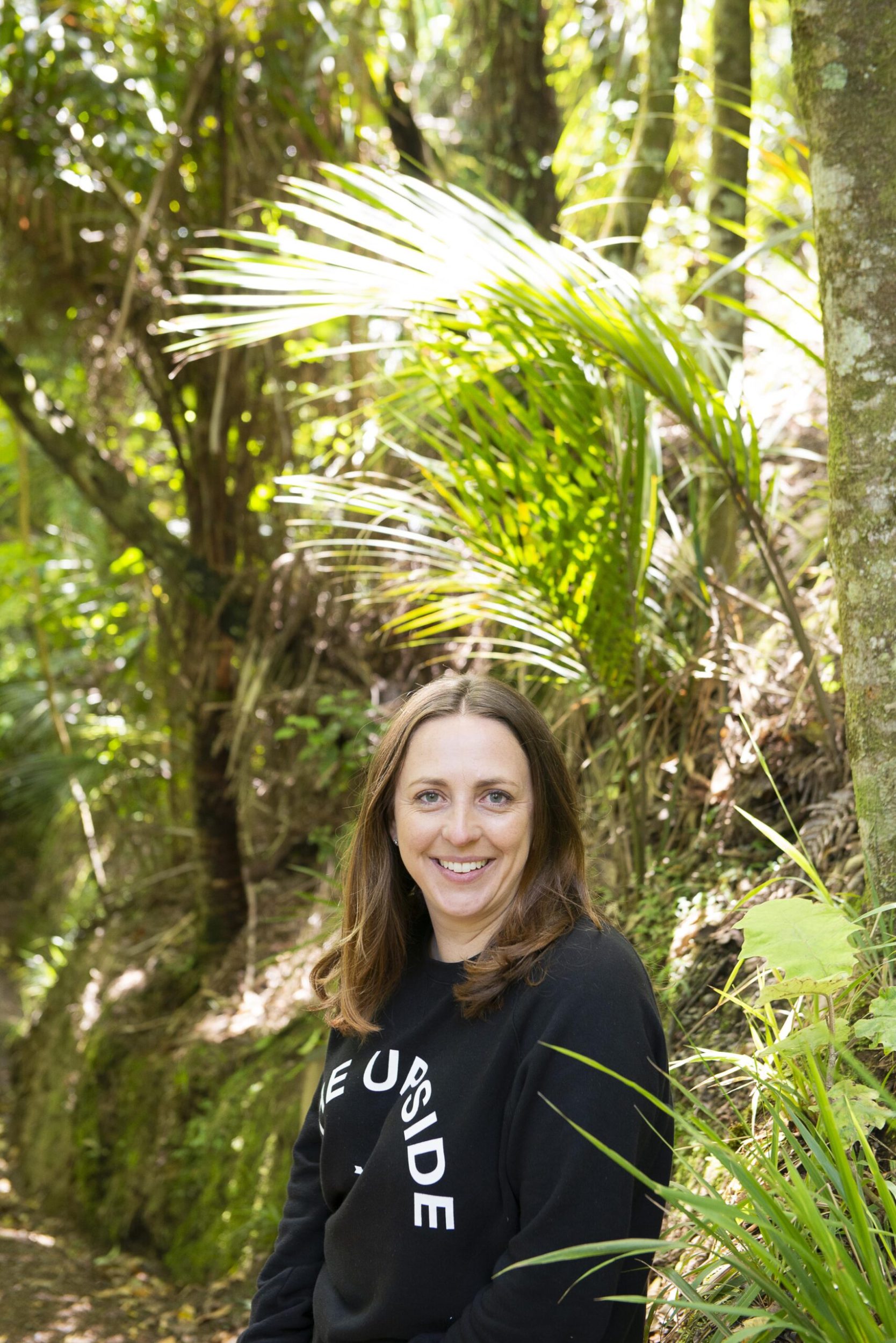 Claudia Zinzan standing by trees