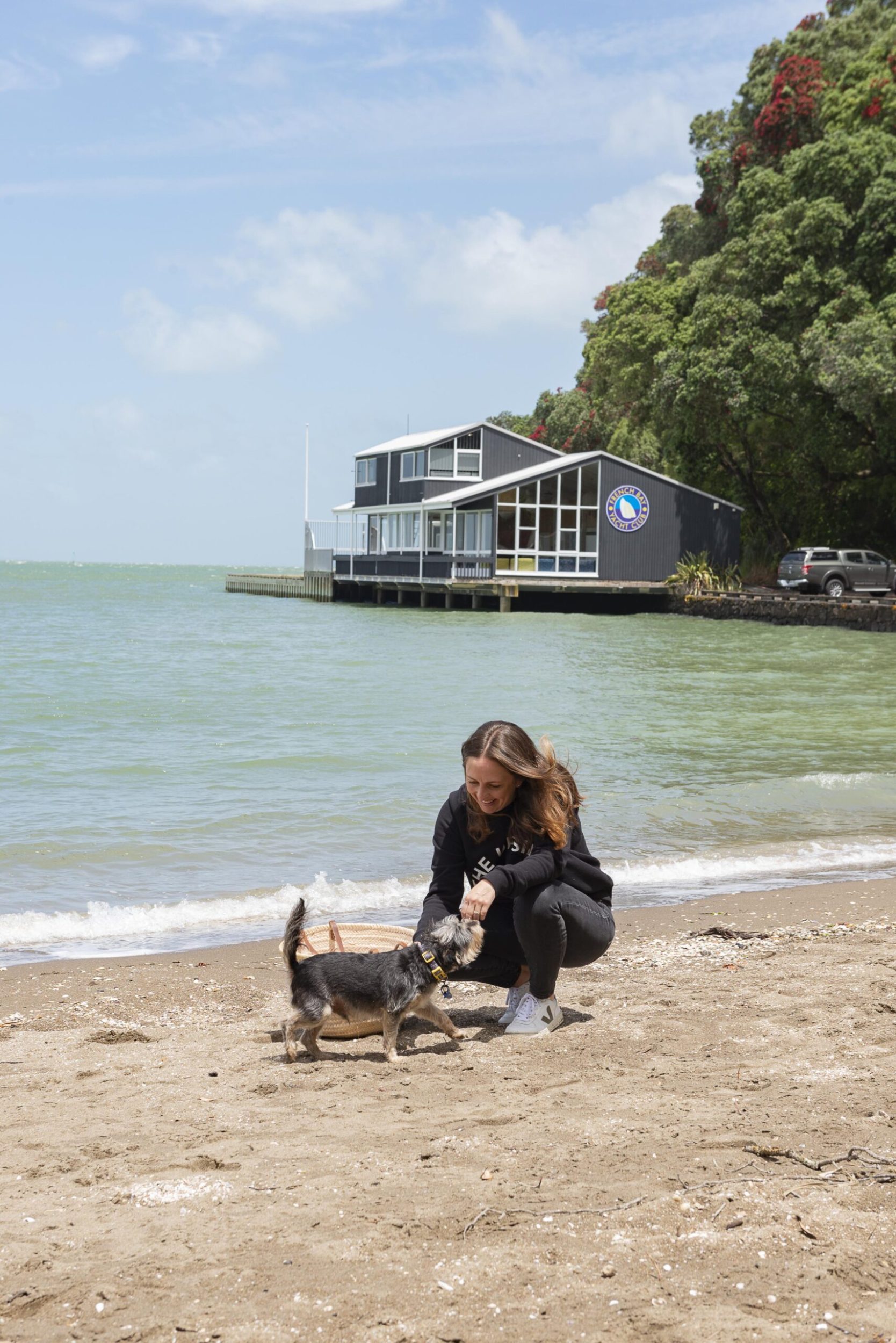 Claudia Zinzan and her dog at the beach