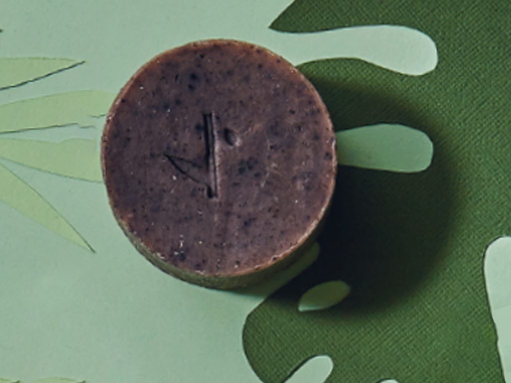 Hemp Collective Hemp Shampoo Bar With Lavender & Rose Geranium on a green background