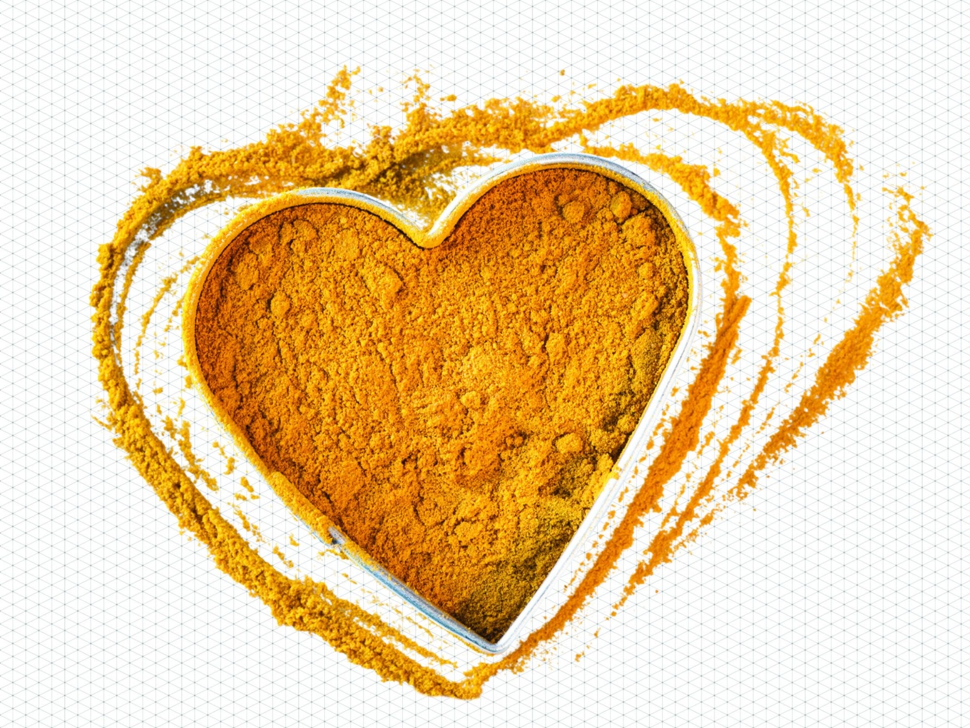 a heart shaped tin of turmeric