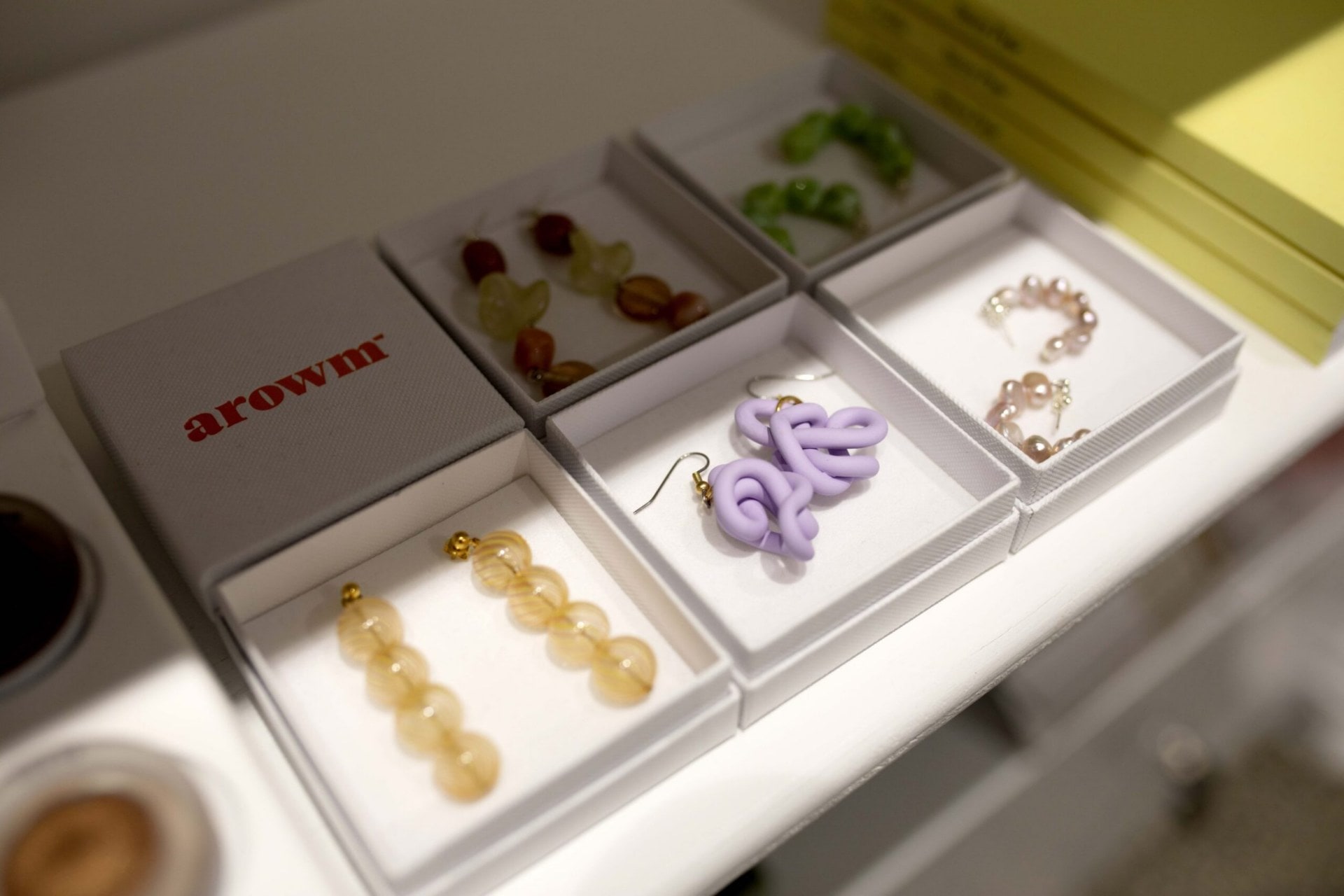 Boxes of Arowm pastel earrings