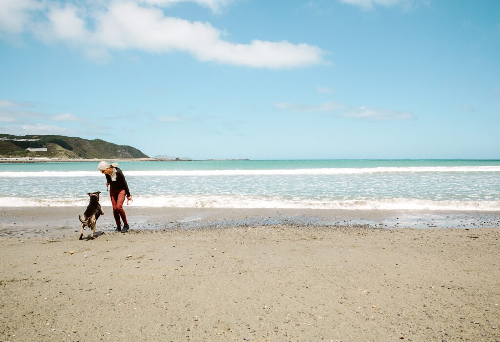 Kathryn Smythe on beach with dog Hadley