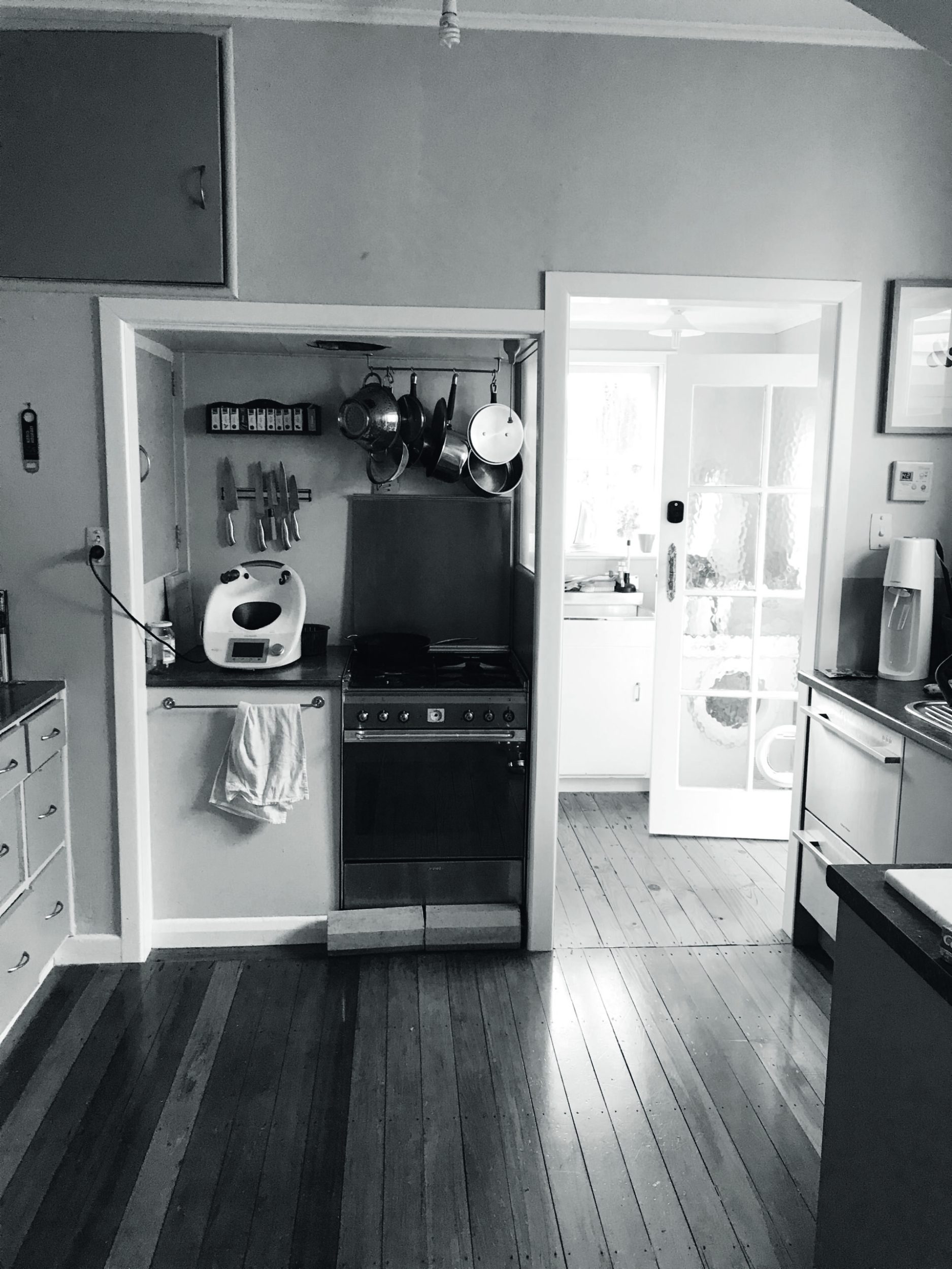 Black and white photo of an old kitchen