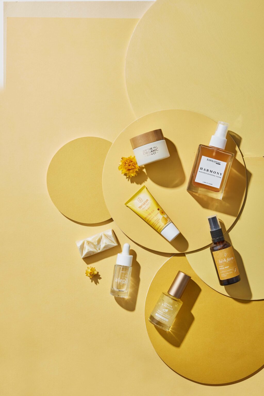 A yellow table with yellow natural skincare products