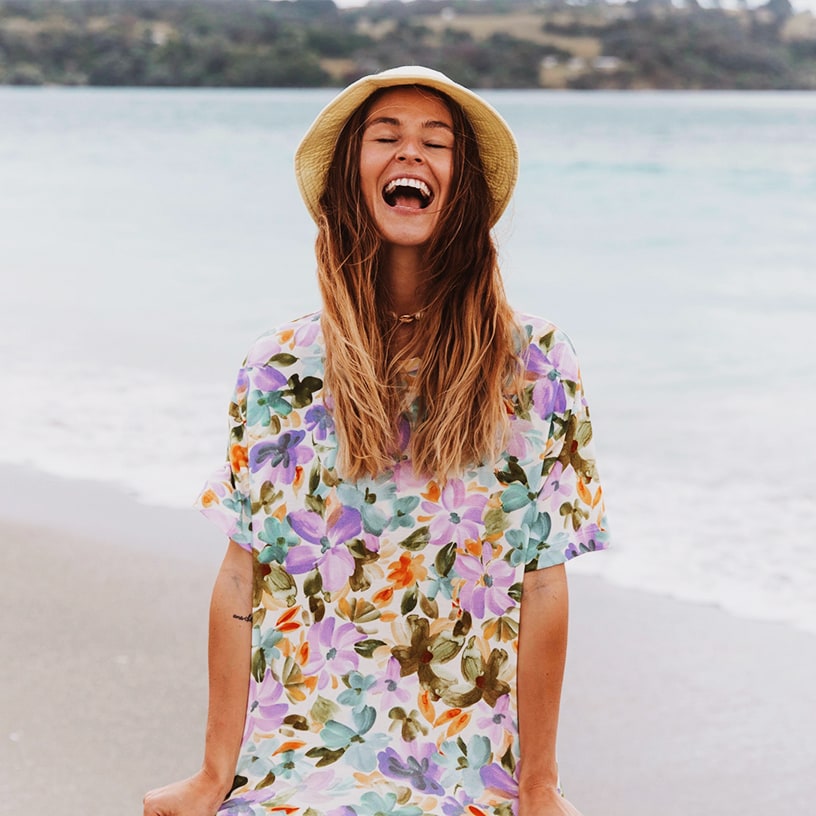 Laura Segedin wearing floral shirt and matching bikini bottoms