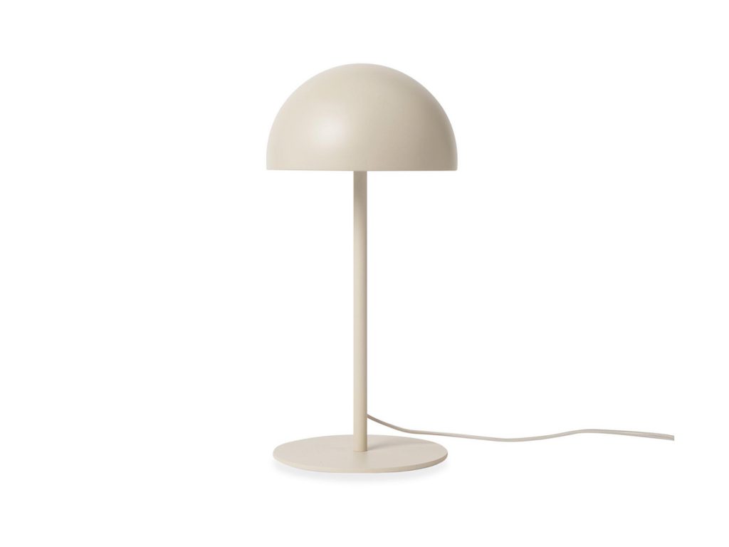 A bone white round table lamp with a curved top