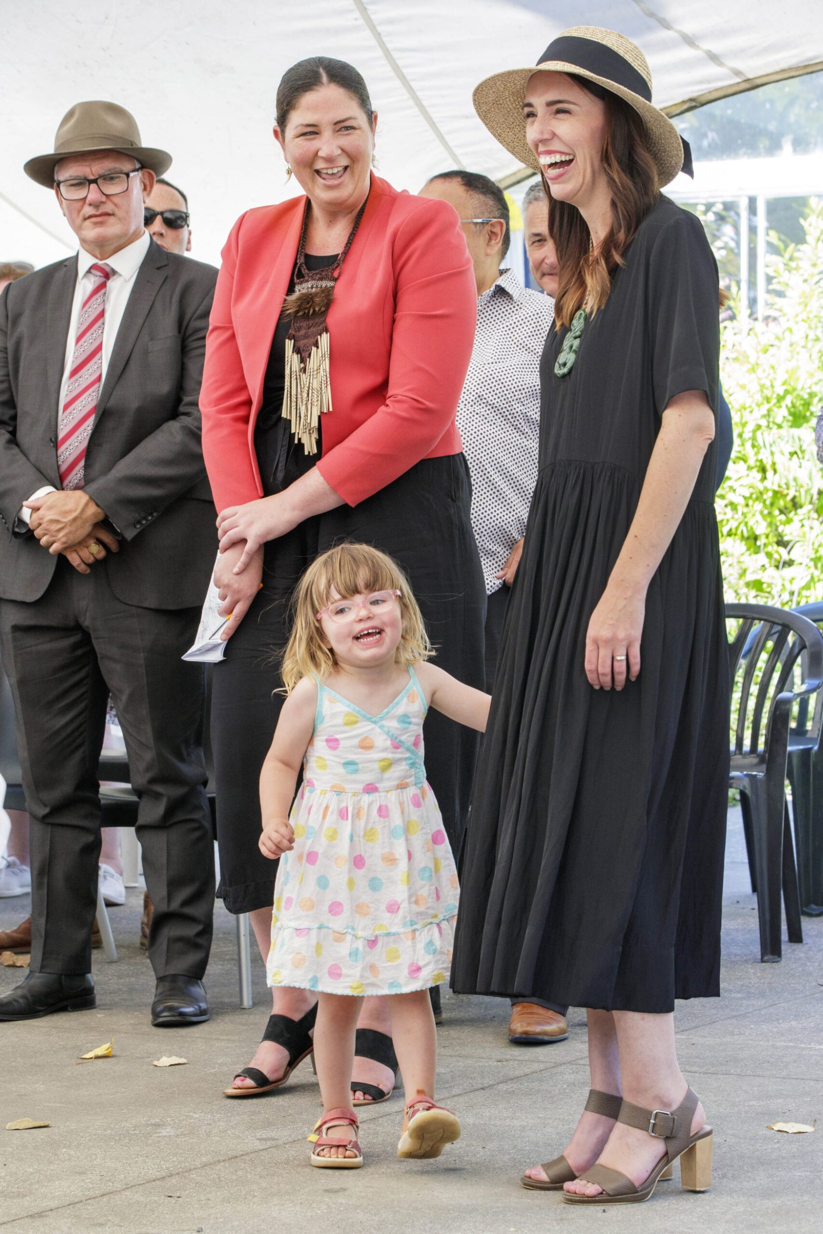 Jacinda Ardern holding the hand of daughter Neve