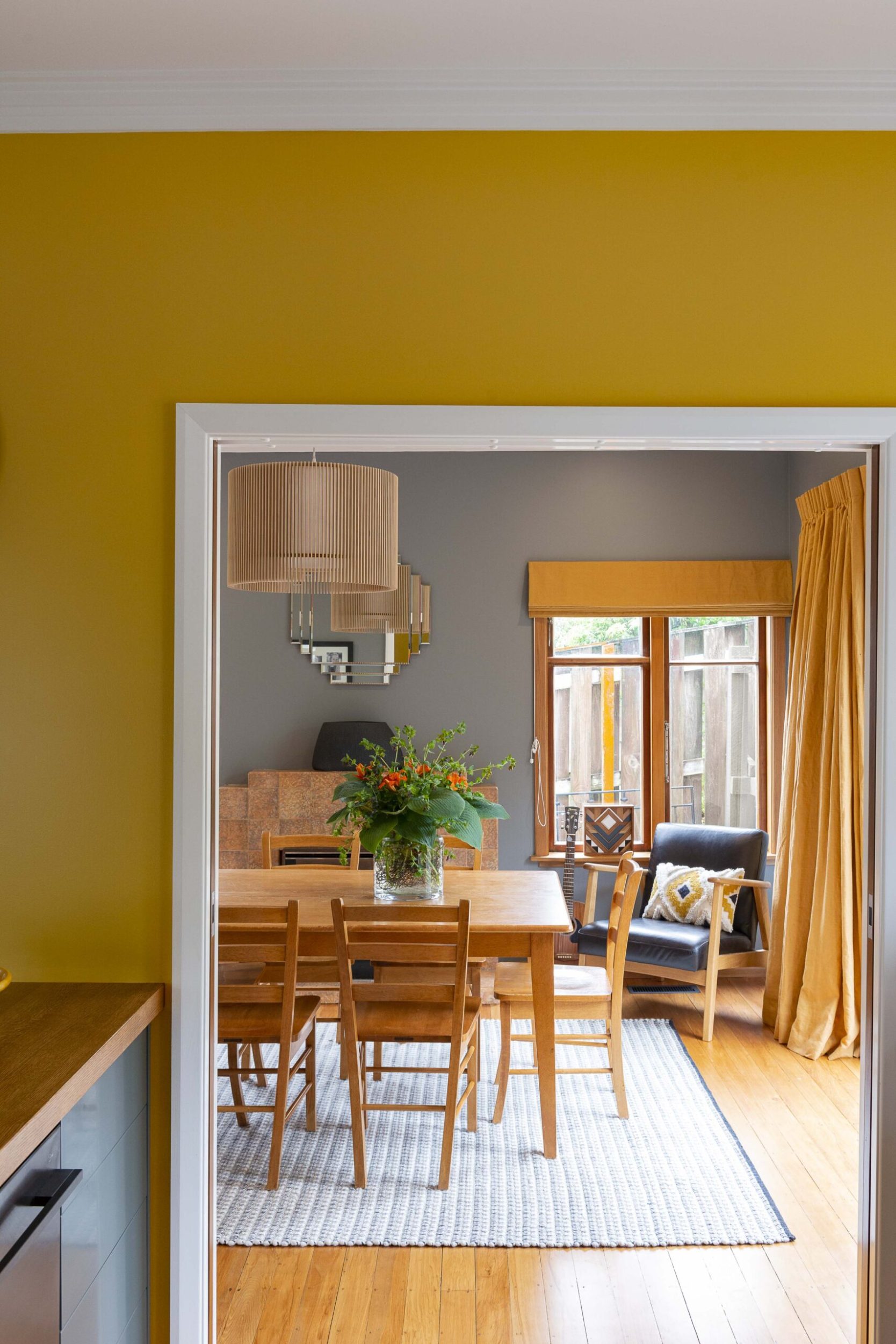 View through doors into dining room with vintage furniture