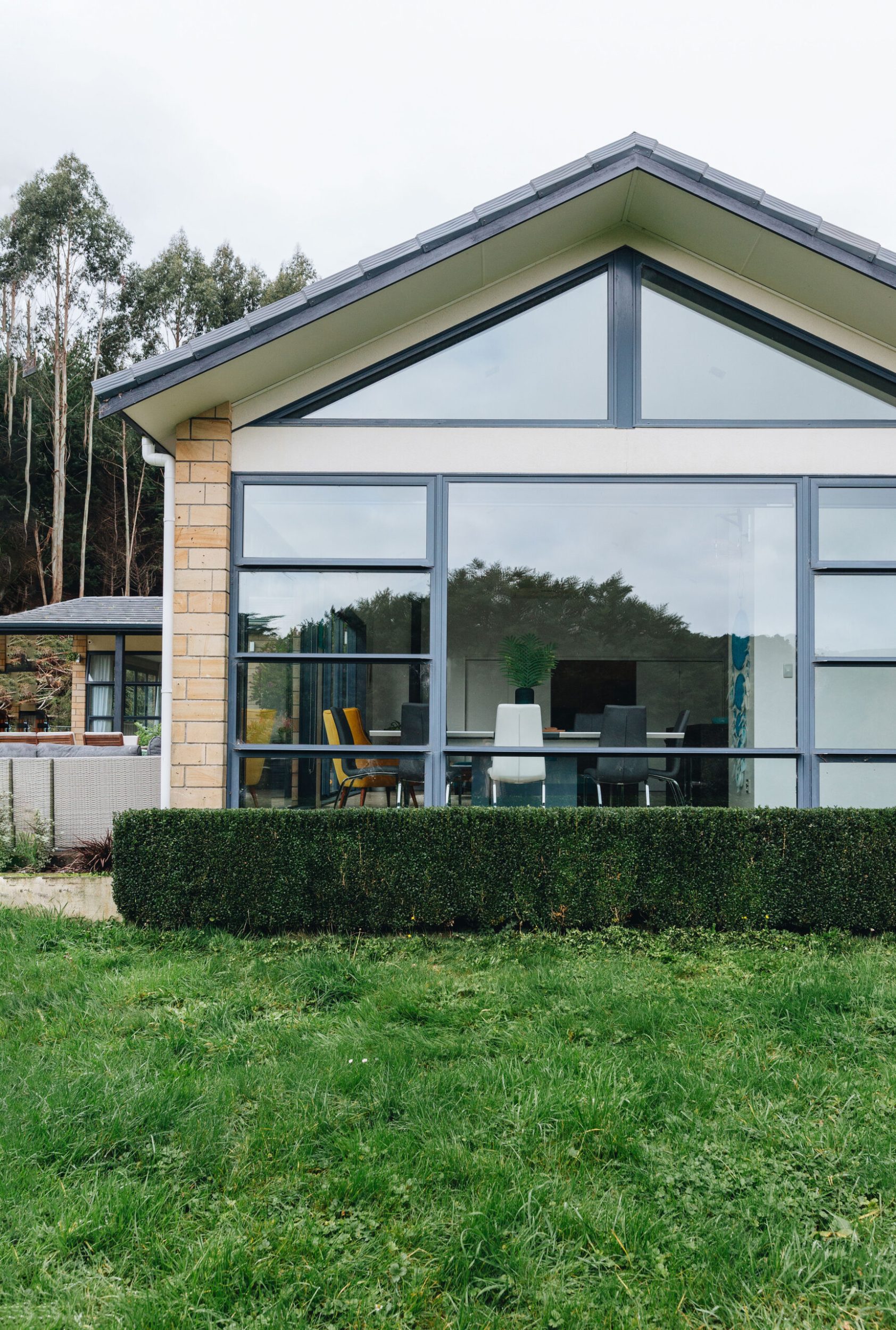 Outside of a house looking through large windows