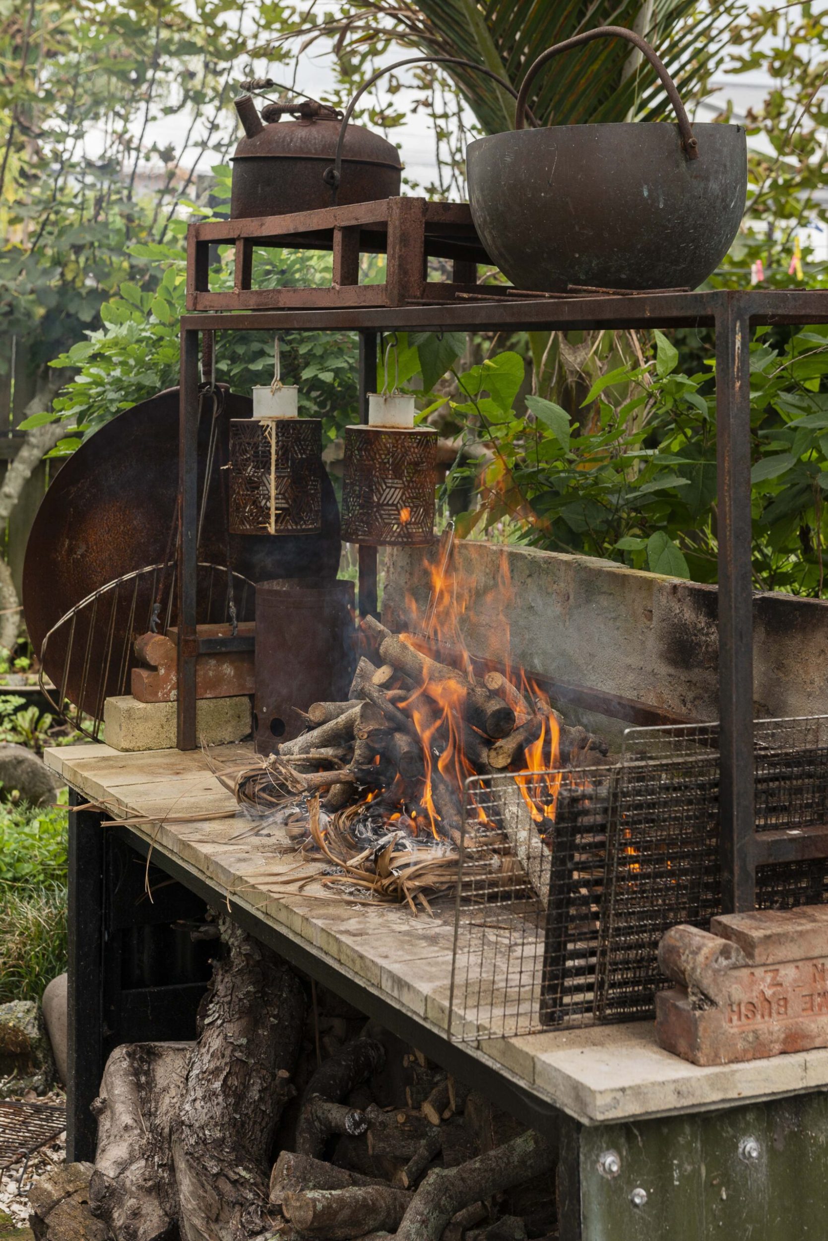 A fire on an outdoor kitchen in a garden