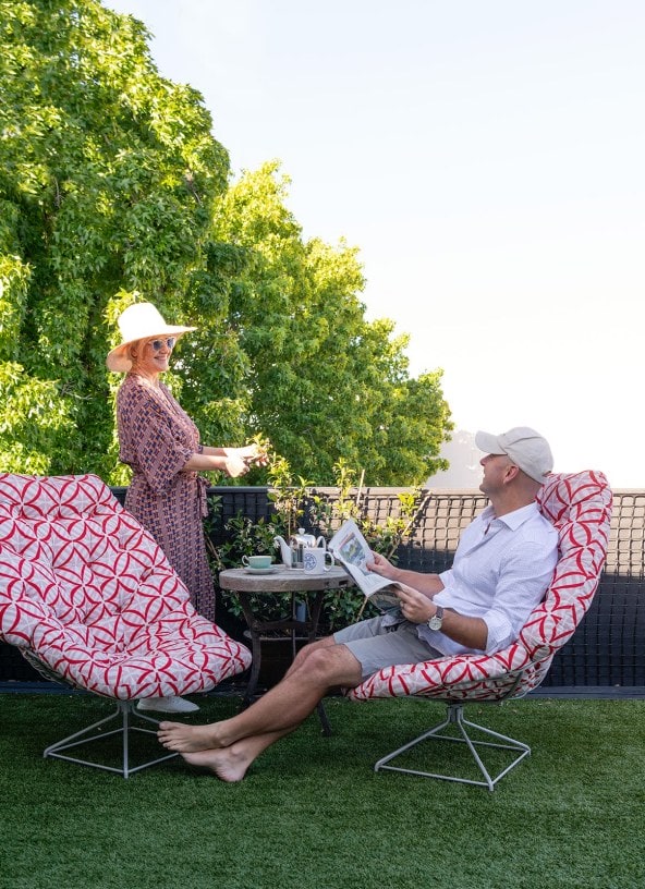 Wendy Nowell-Usticke and Greg Quinn on terrace with grass astroturf 