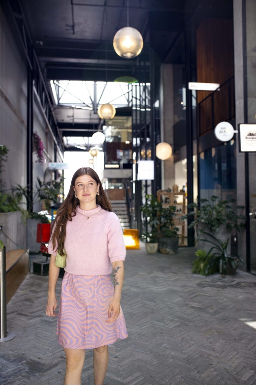 Tiffany Clayton walking through shopping lane