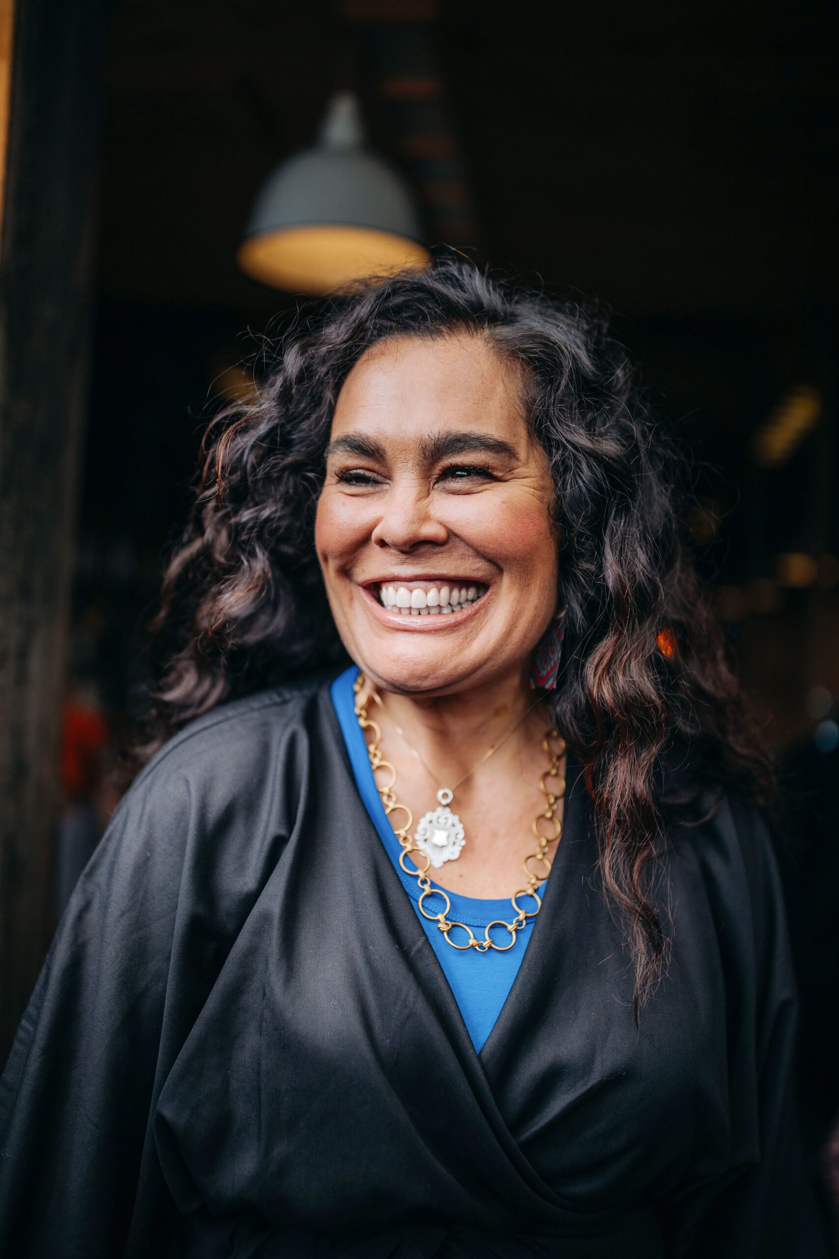 Portrait of Rachel House wearing blue top and black jacket