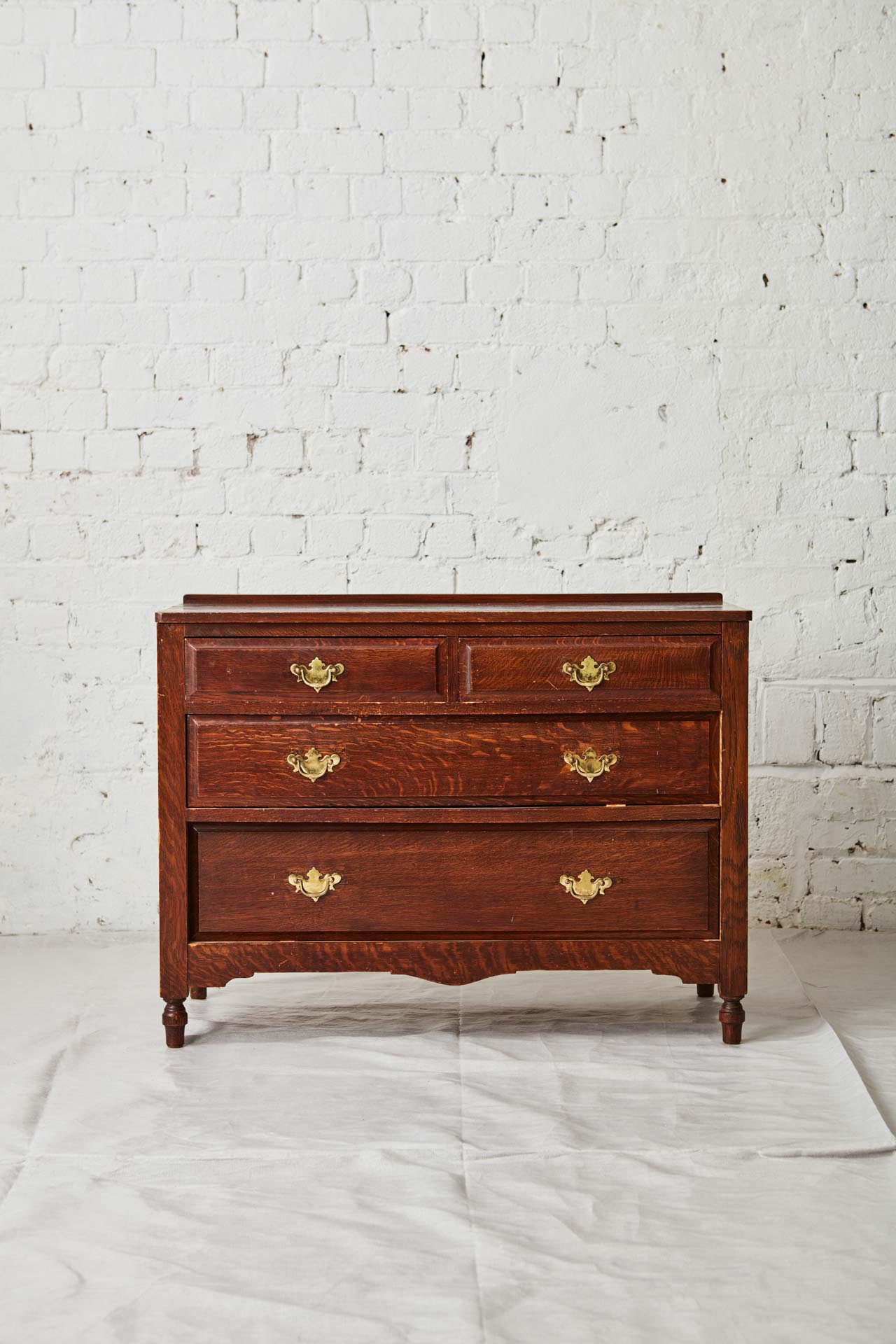 Vintage wooden drawers against brick background