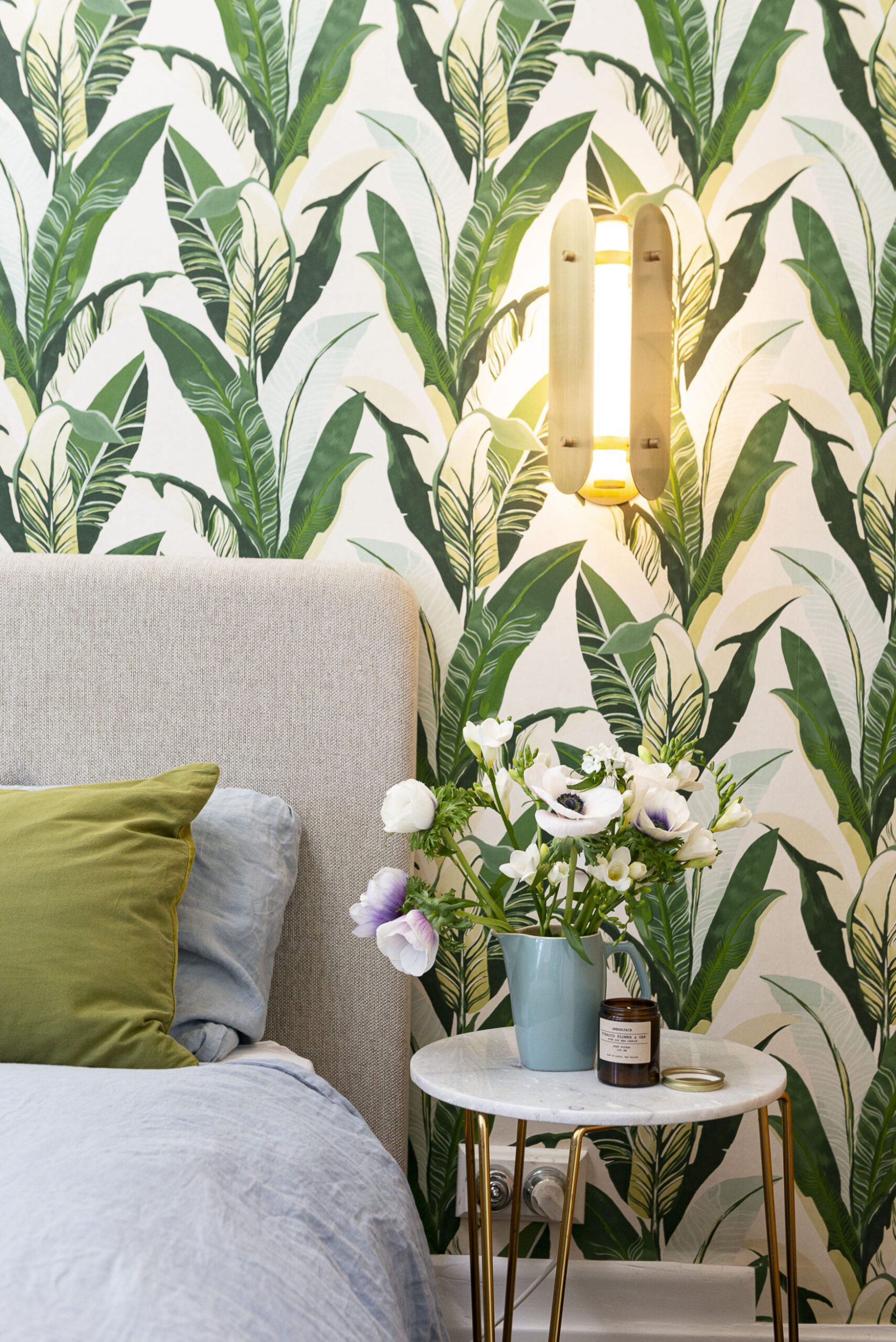 Botanical wallpaper with a bed