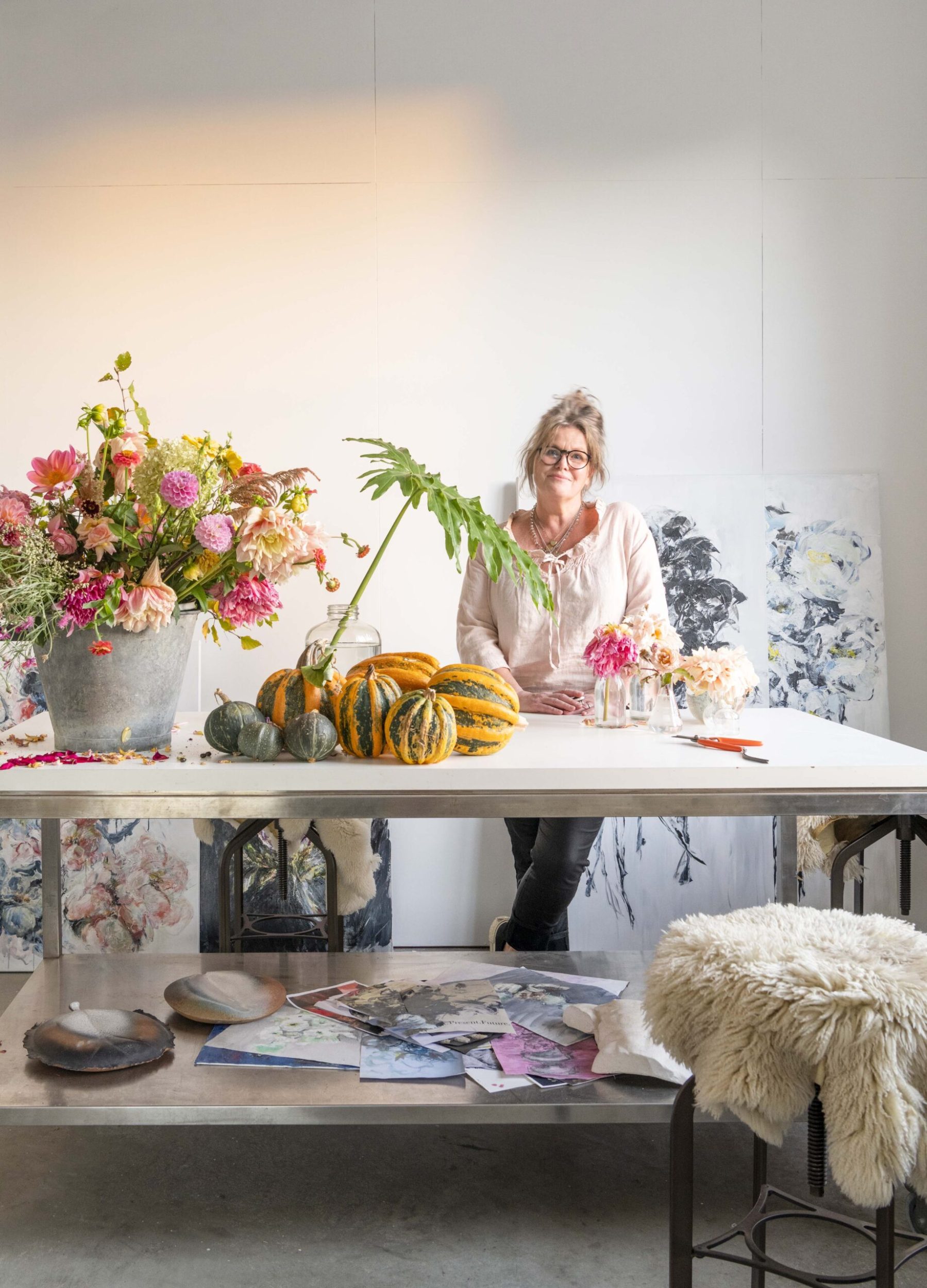 Lizzie Beere in her art studio surrounded by her art