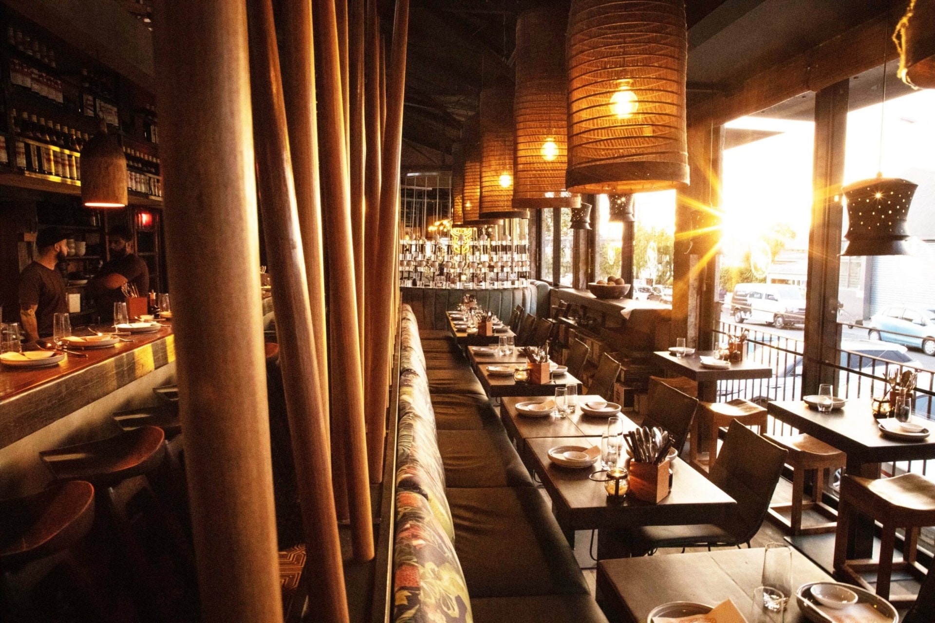 Interior of the Blue Breeze Inn showing gold hanging lights and floral patterned chairs