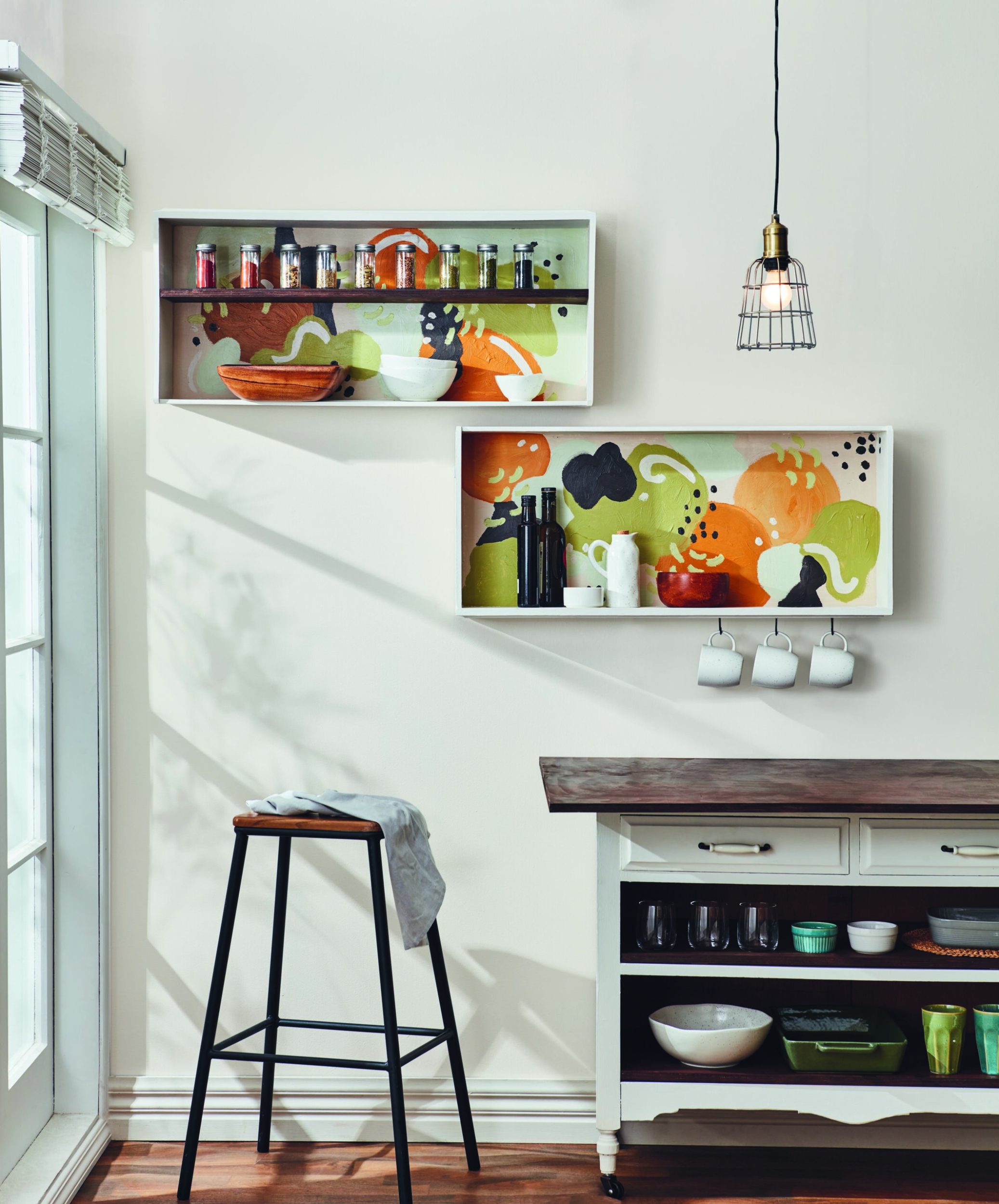 Upcycled drawers hanging on the wall as kitchen storage for cups and bowls