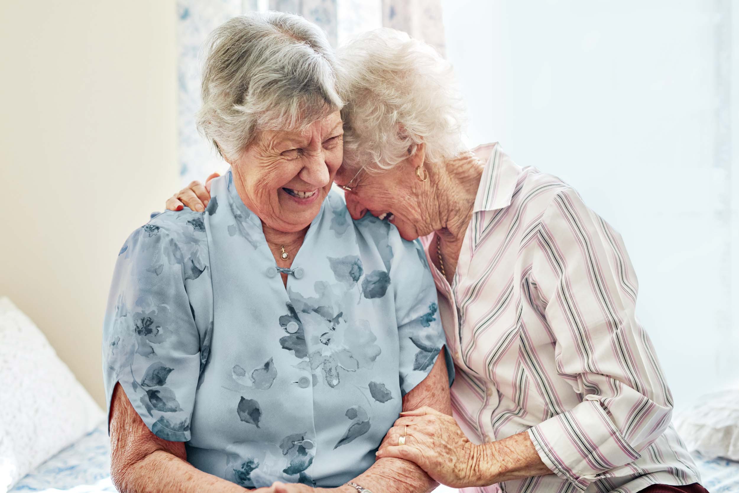 two older woman laughing together